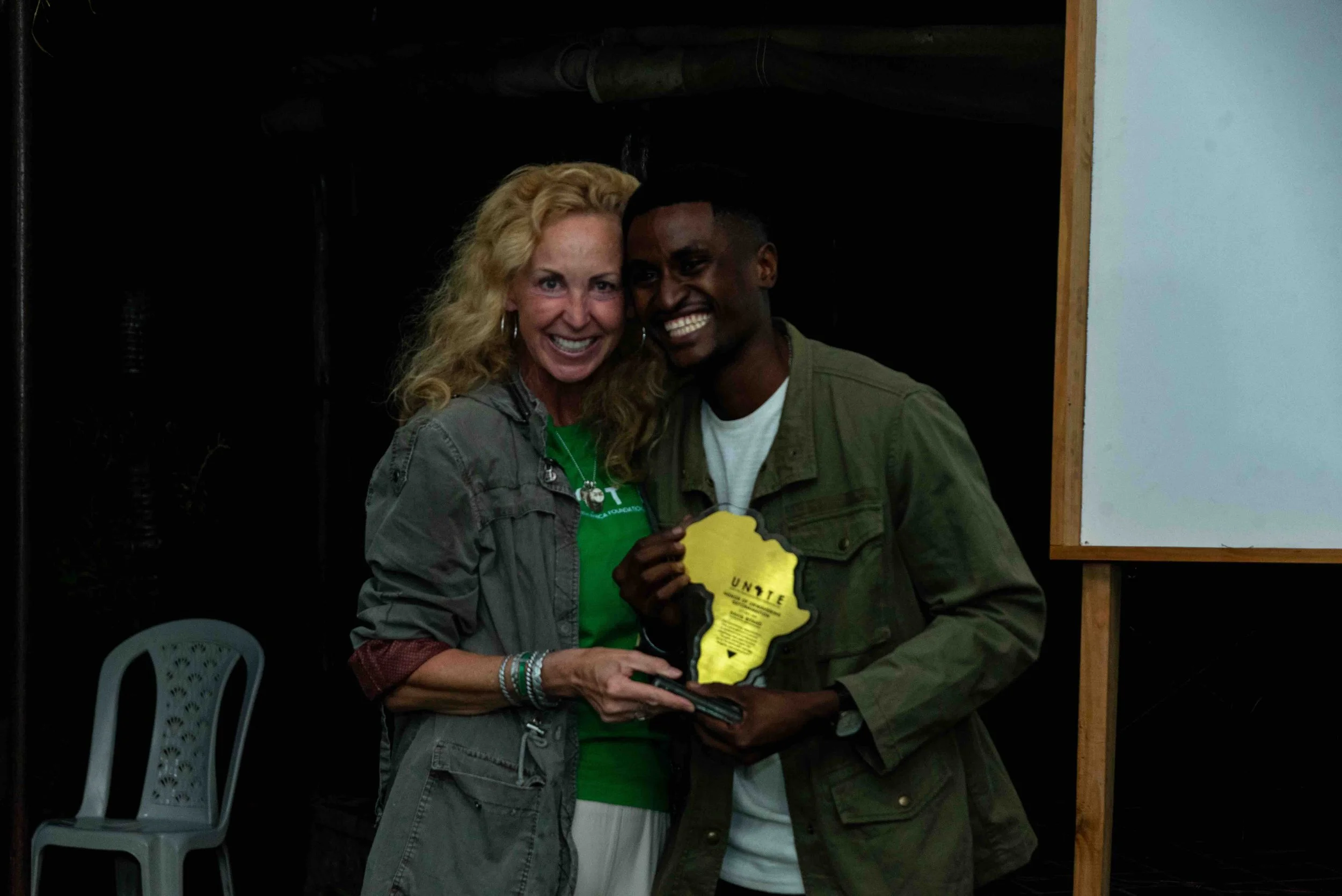 2025.10.17_Anne Wells giving a special award to David Bitaho.jpeg