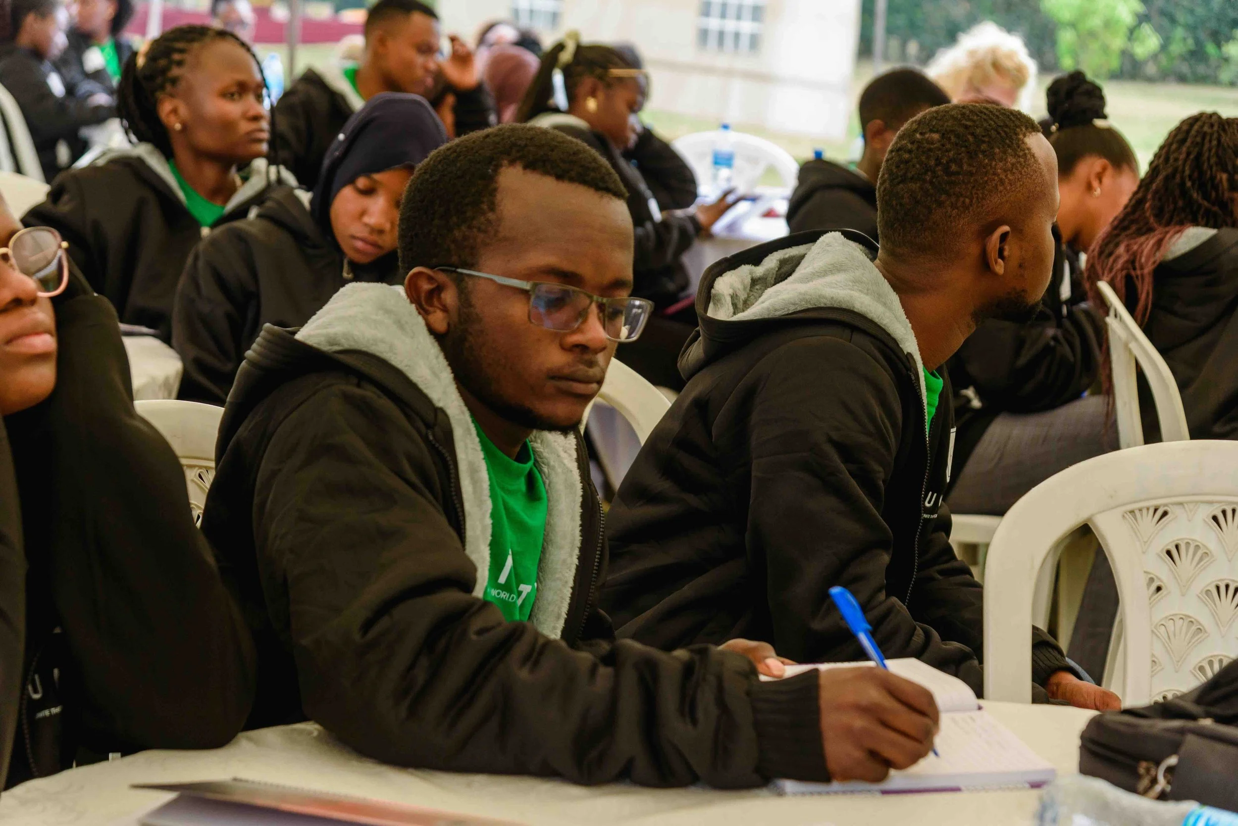 2025.10.16_Onesmo Shadrack taking notes during the session.jpeg