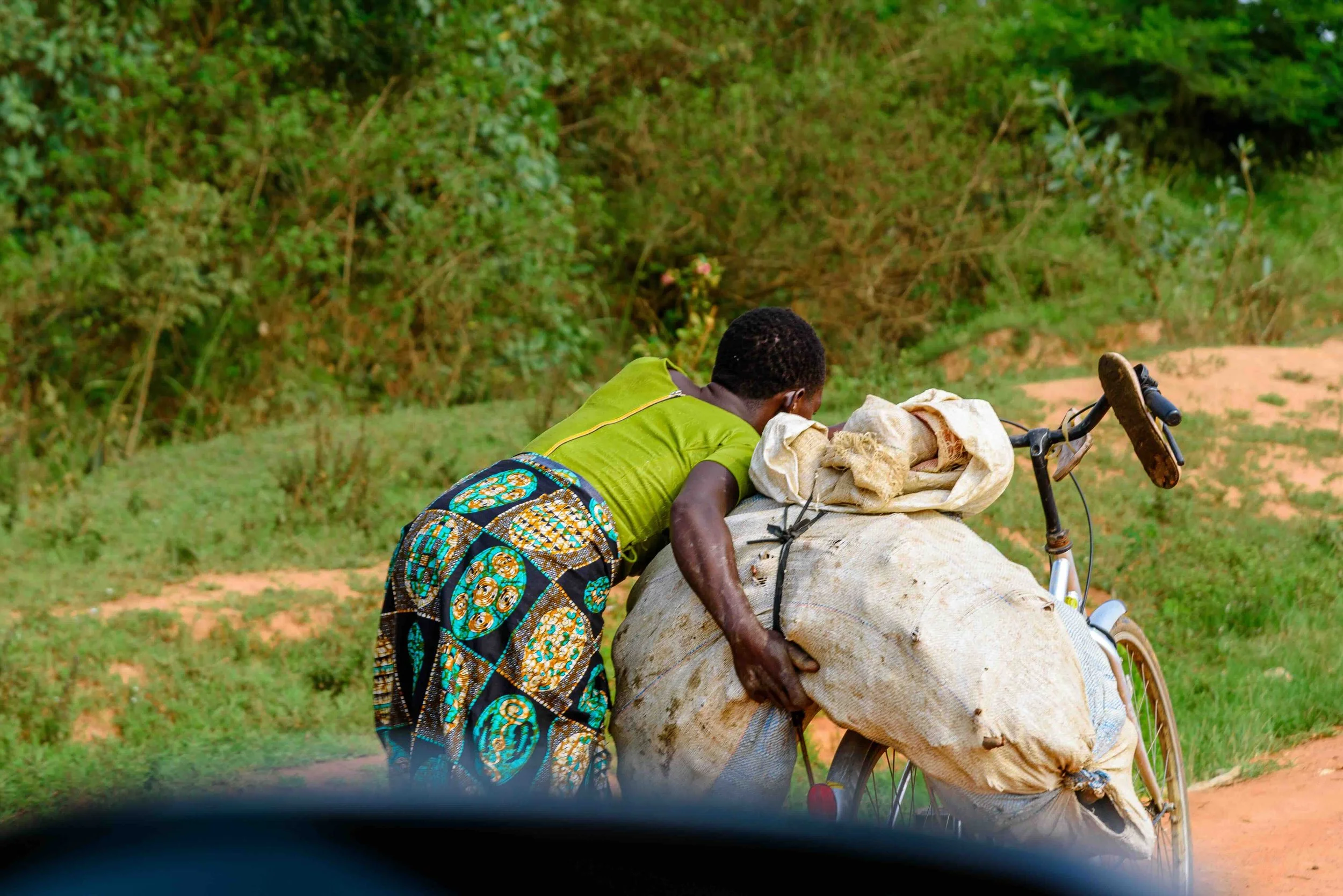 2026.02.25_Photo of a woman pushing a cargo on the bicycle.jpeg