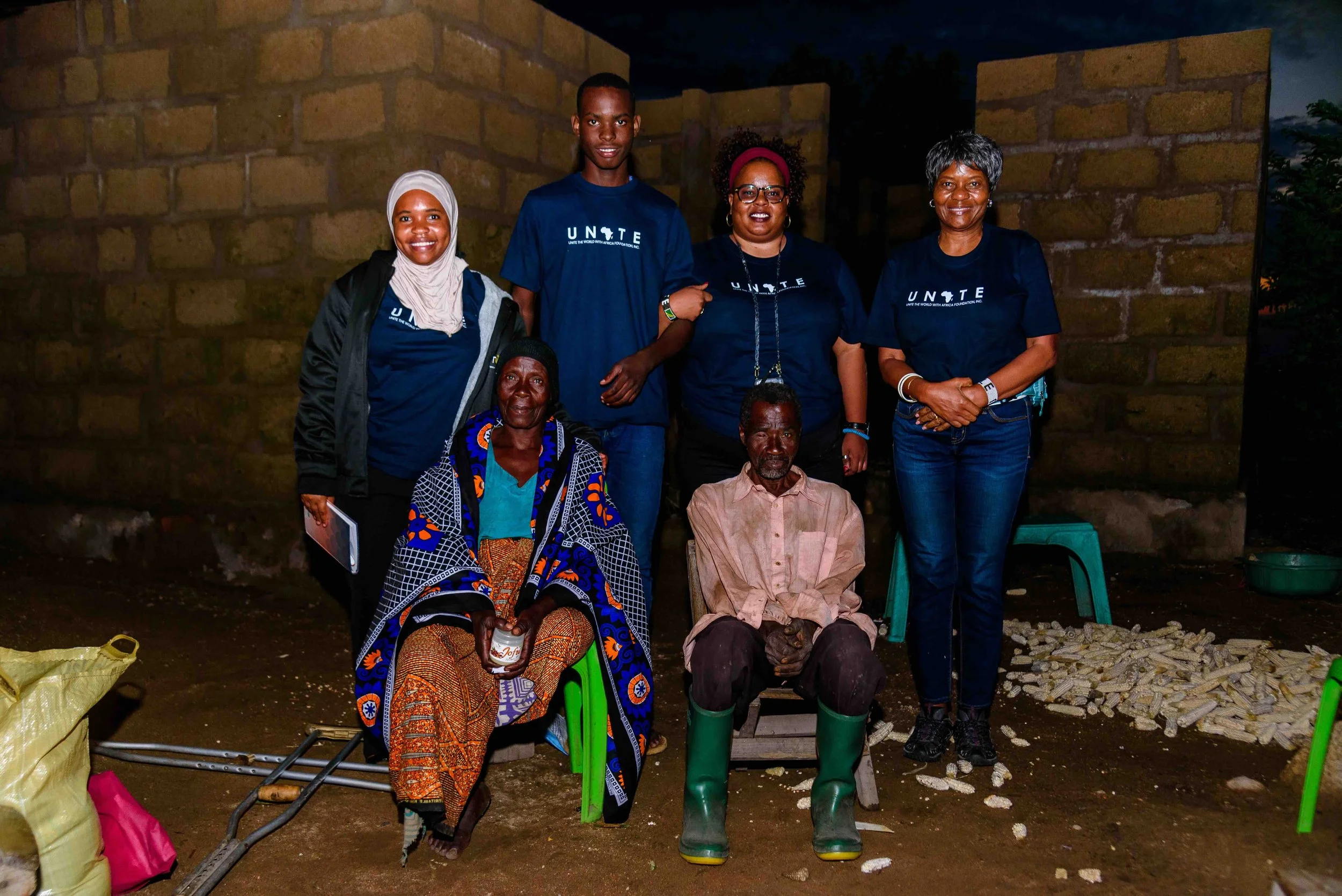 Justine and grandparents and Unite teammates_Feb 2026 home visit.jpg