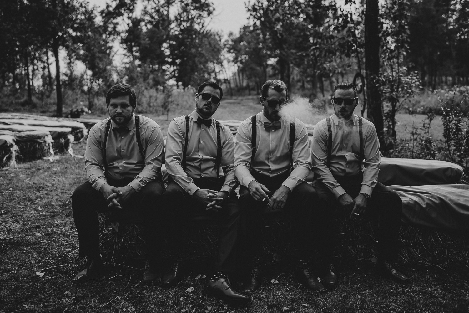hard looking groomsmen smoking Alberta Intimate Farm wedding calgary banff wedding photographer elopement