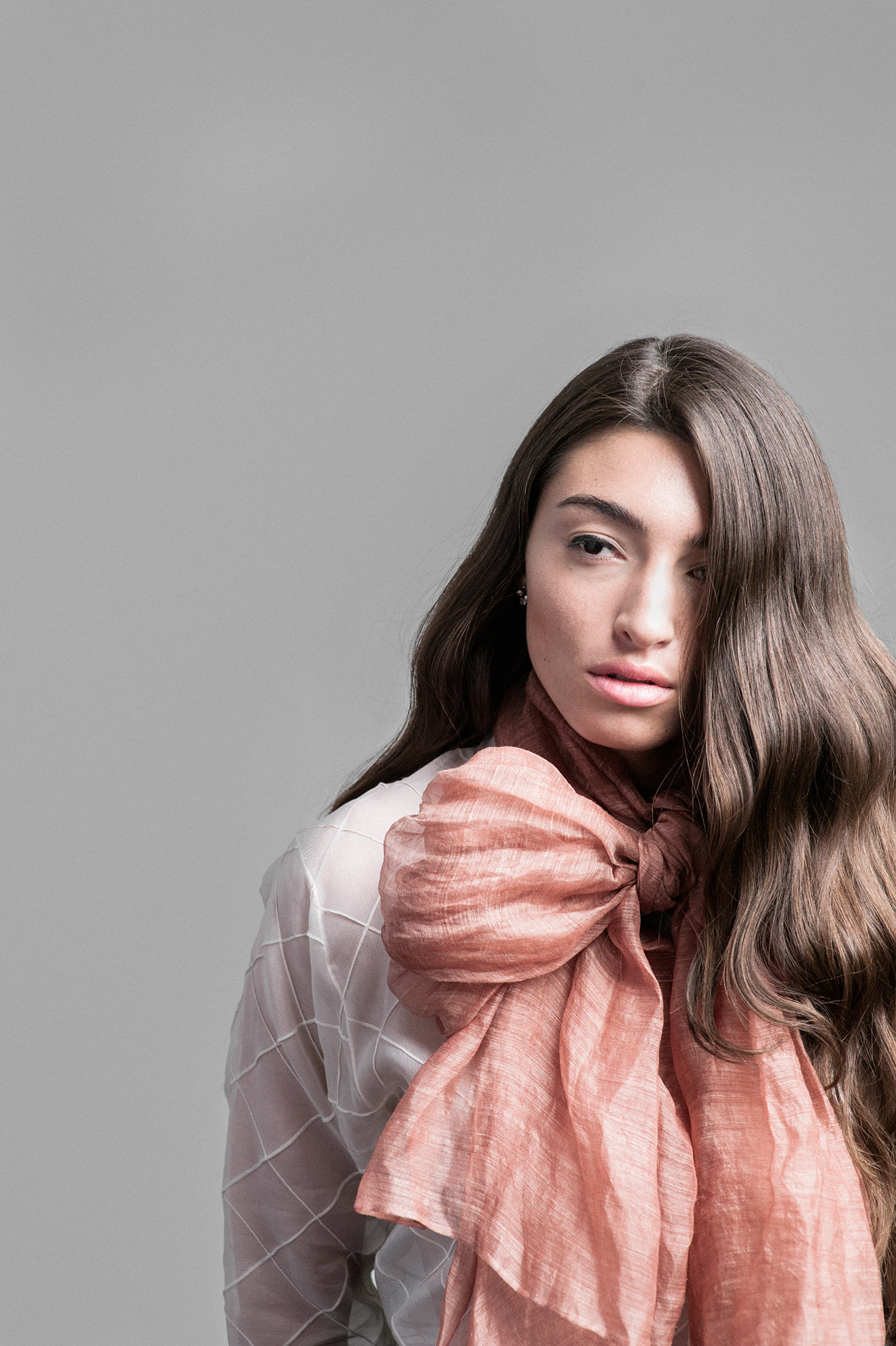 Steph is wearing a Vintage Sheer Ivory Mandarin Blouse and a Vintage clay silk scarf.