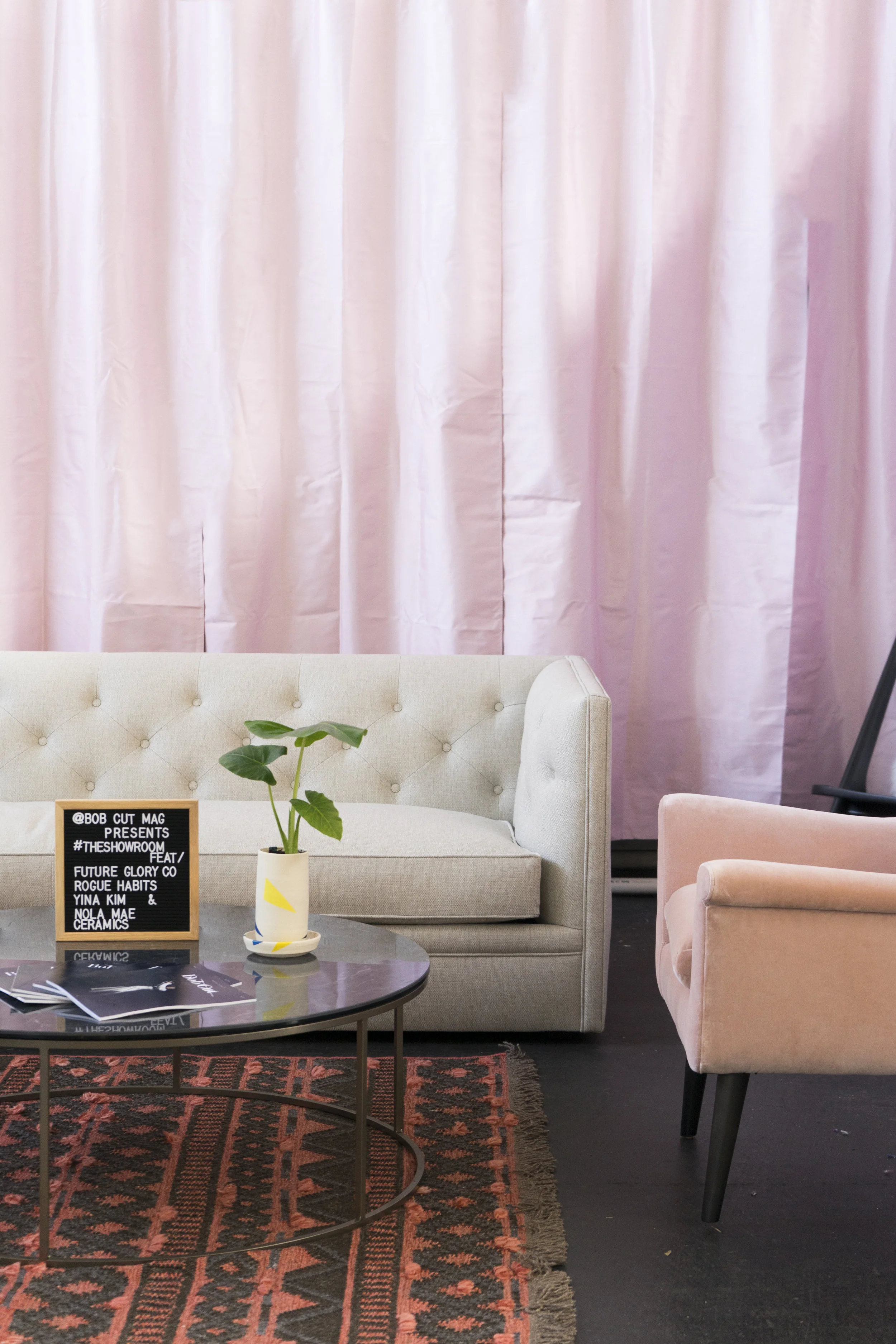 Featuring the Embers Rugs , Tyne Round Coffee Table , Nola Mae Ceramics, Murphy Chair & Ottoman , and the Macalester Sofa . 