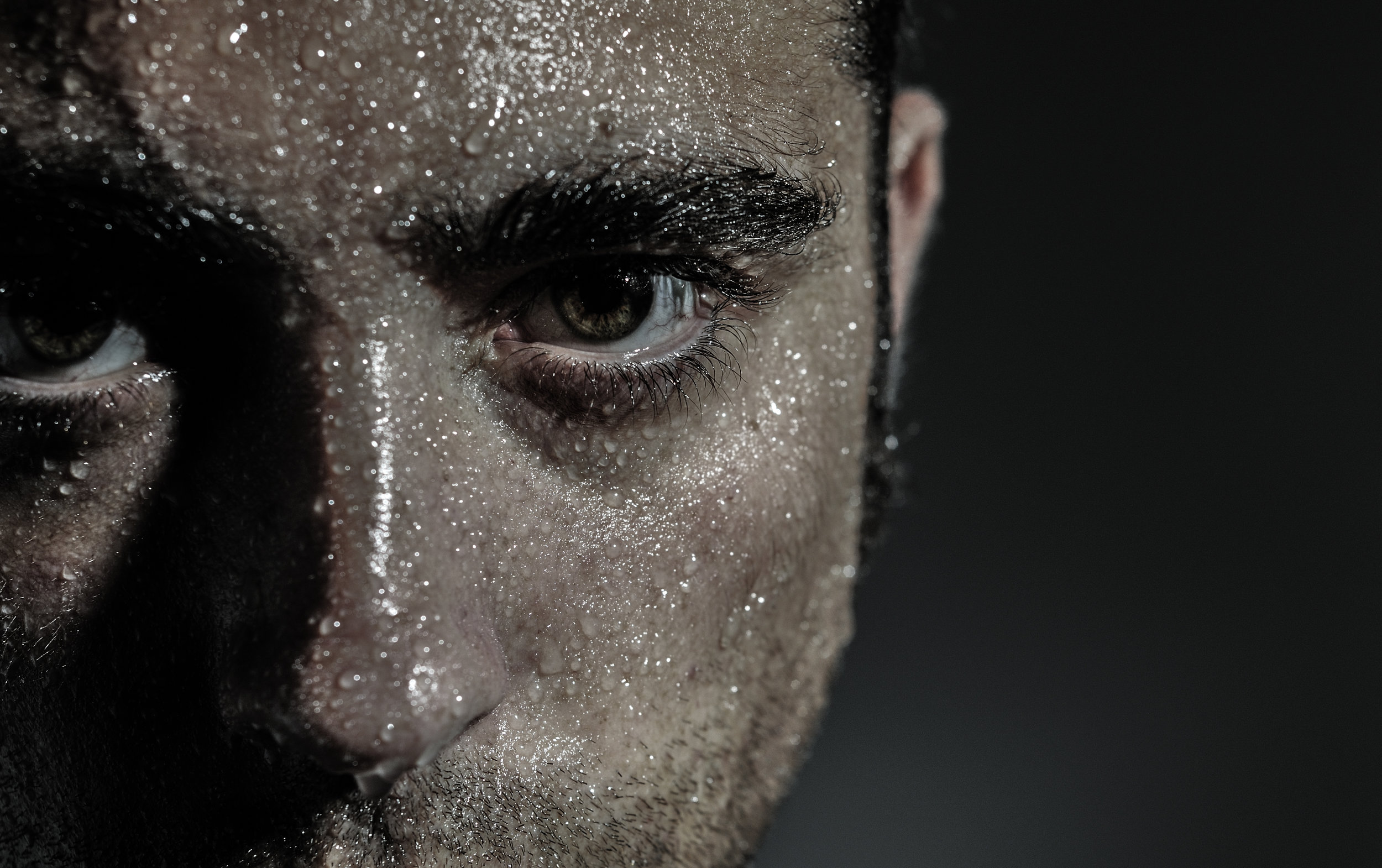 Copy of Closed portrait of a man with water drops