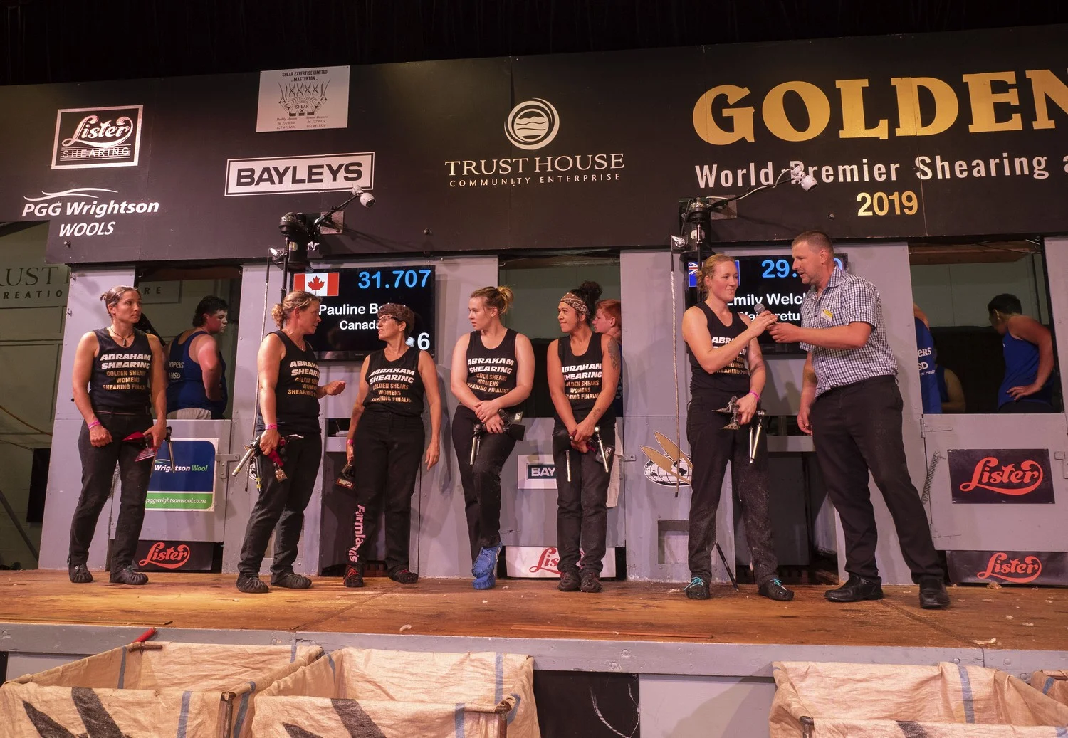 All over baa the shouting...finalists await the reult of the Golden Shears women's shearing final, from left Pauline Bolay (second), winner Emily Welch, Jills Angus Burney (5th), Laura Bradley (4th), Jackie Paku (6th) and Sarah Higgins (4th). PHOTO/Pete Nikolaison, Golden Shears.