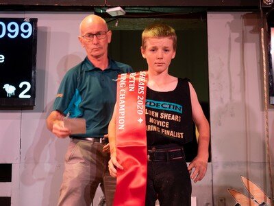 Wairoa College pupil Ryka Swann, 14, with the prized ribbon and acclamation as Golden Shears Novice shearing champion for 2020.  PHOTO/Pete Nikolaison, Golden Shears.
