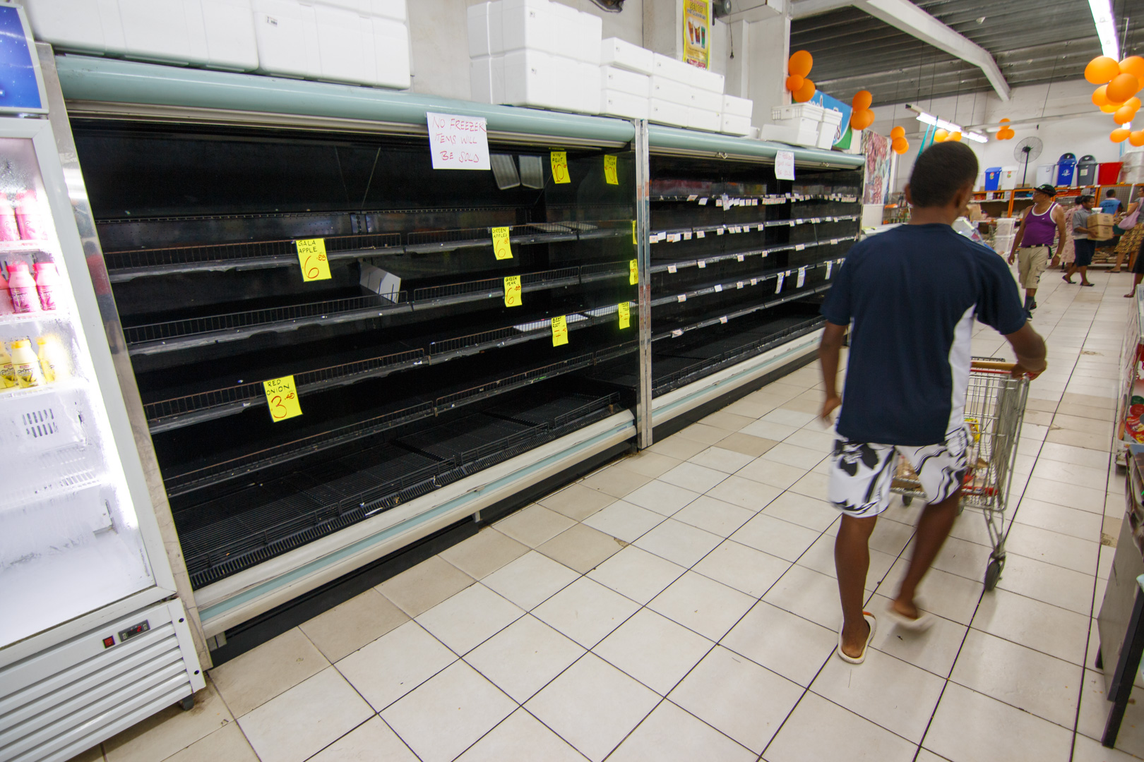  The refrigerated section of a supermarket lays empty of products after power losses due to Cyclone Winston in Fiji's capital Suva, February 22, 2016. 