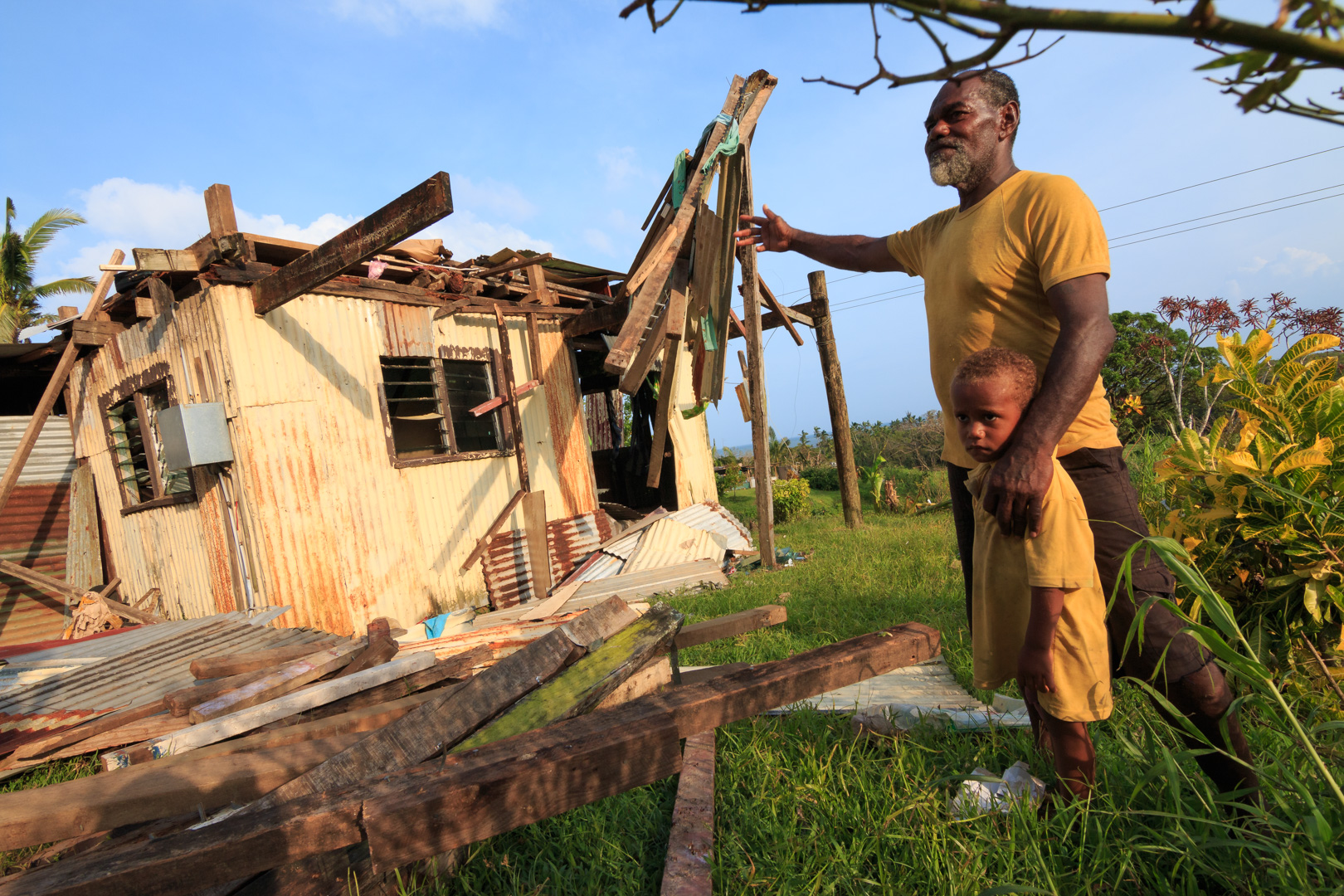  Ikavatu from the village of Namena in Tailevu, Fiji, gestures towards his damaged house after Cyclone Winston swept through the area on February 20, 2016. 