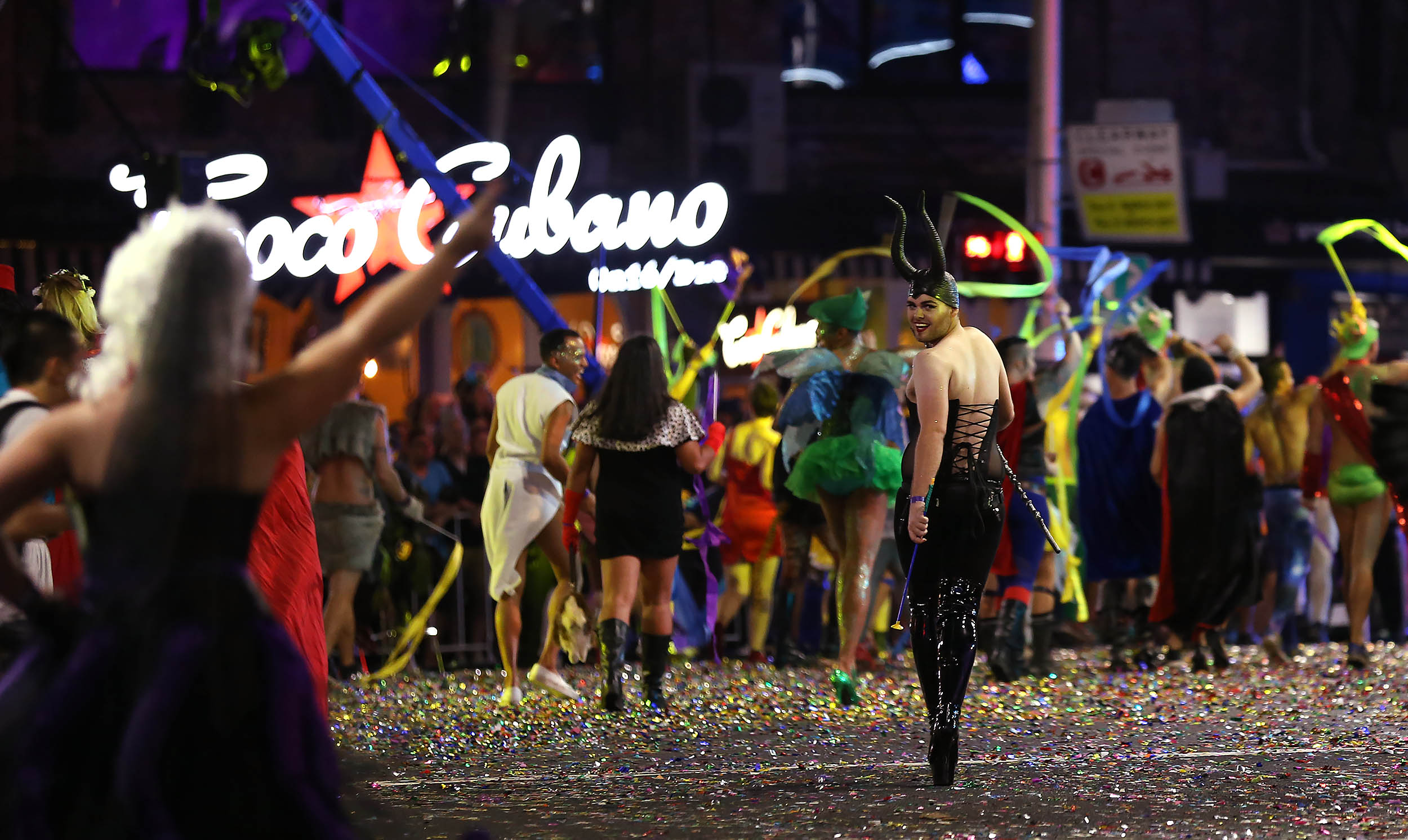  A participant in the annual Sydney Gay and Lesbian Mardi Gras parade wearing Maleficent horns looks back on the parade route in Sydney, Australia, March 4, 2017. 