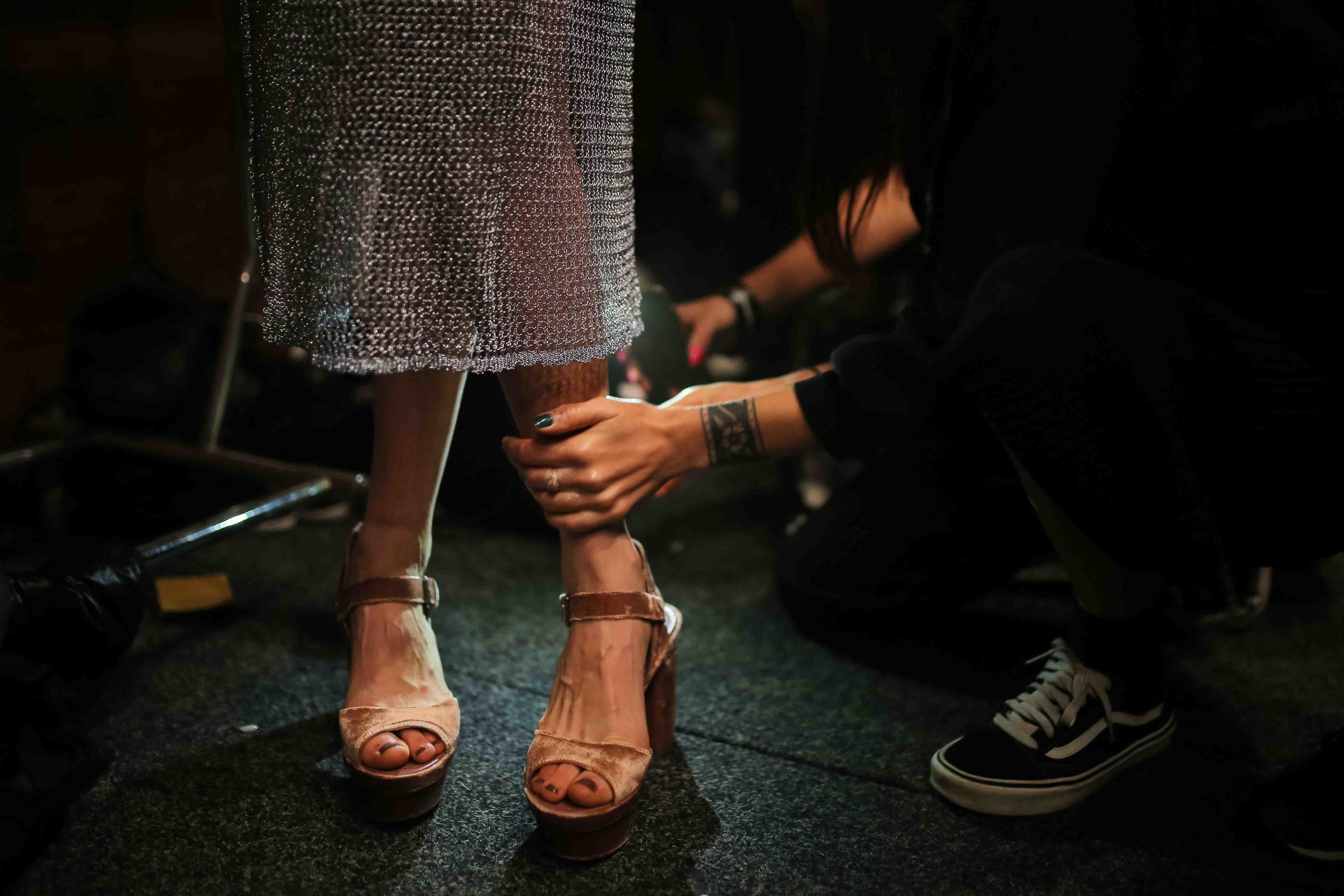  A model for We Are Kindred is prepared for a runway show back stage during Fashion Week Australia in Sydney, Australia. 