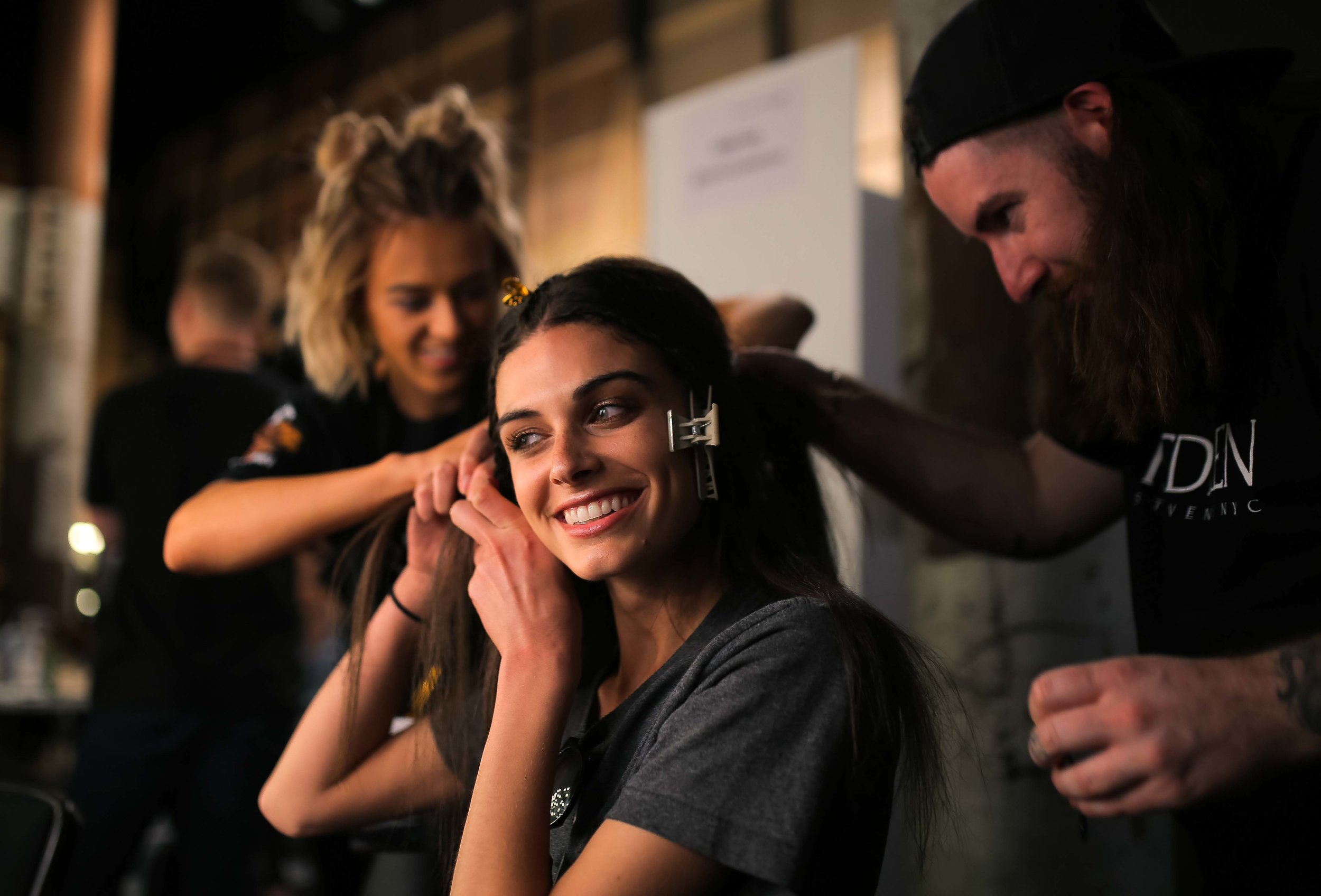  A model has her hair prepared back stage before a runway show at Fashion Week Australia in Sydney, Australia. 