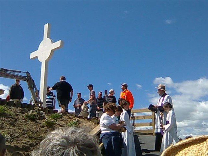 Matthew Skews used his digger to position the large Cross