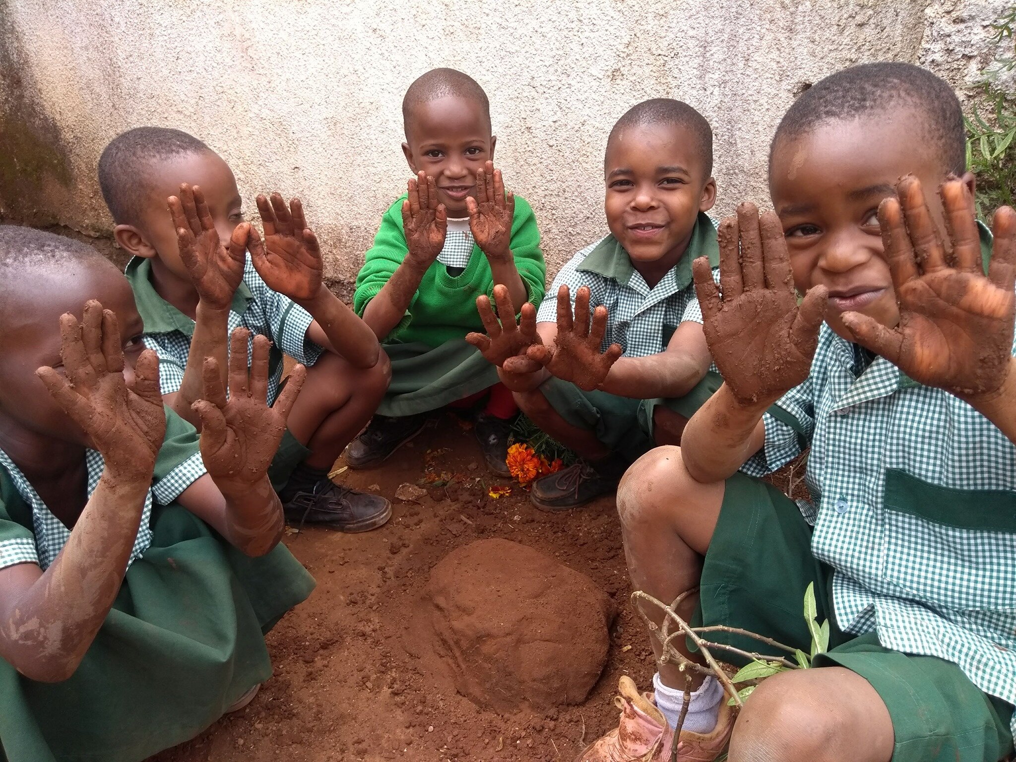 The Roof Of Africa children getting muddy.jpg