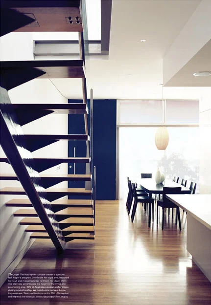 Staircase The copy reads: This page: The floating oak staircase creates a spacious feel. Roger’s pregnant wife broke her right arm, fractured her scull and miscarried after he threw her down them. The staircase accentuates the height of the living and entertaining area. 23% of Australian women suffer domestic abuse. We need some serious home improvement. Visit unifem.org.au and help stop the violence.