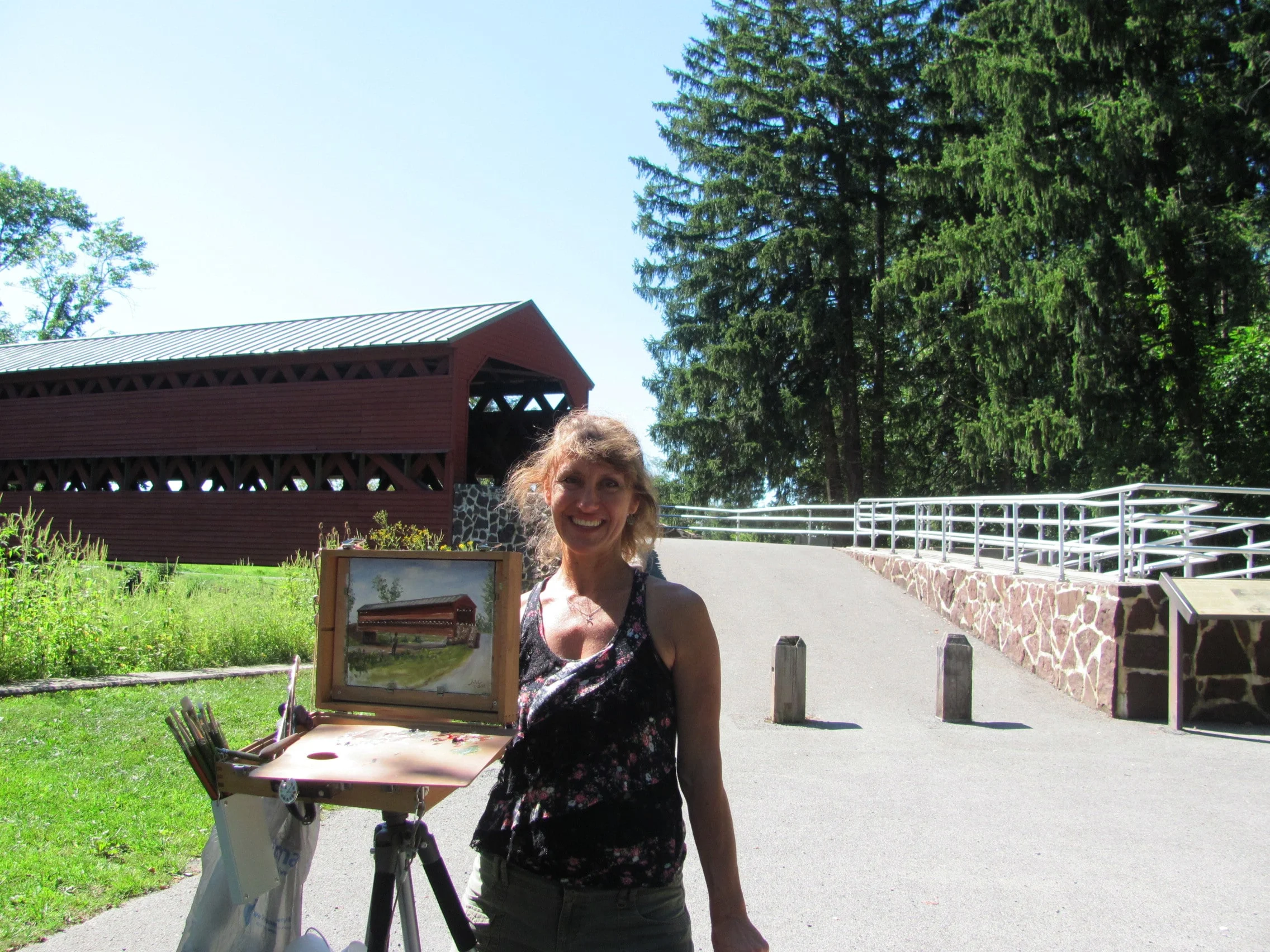 Sach's Covered Bridge plein air painting with artist.JPG