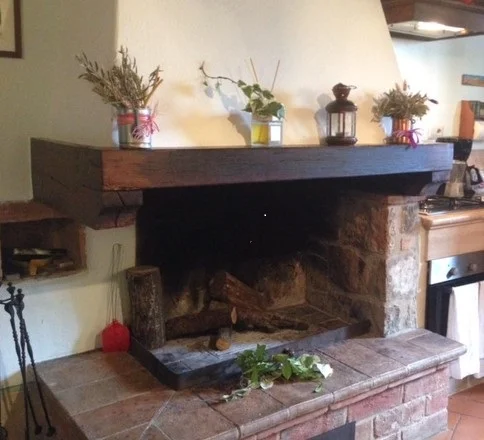 The kitchen / sitting area fireplace in my Cretaiole apartment