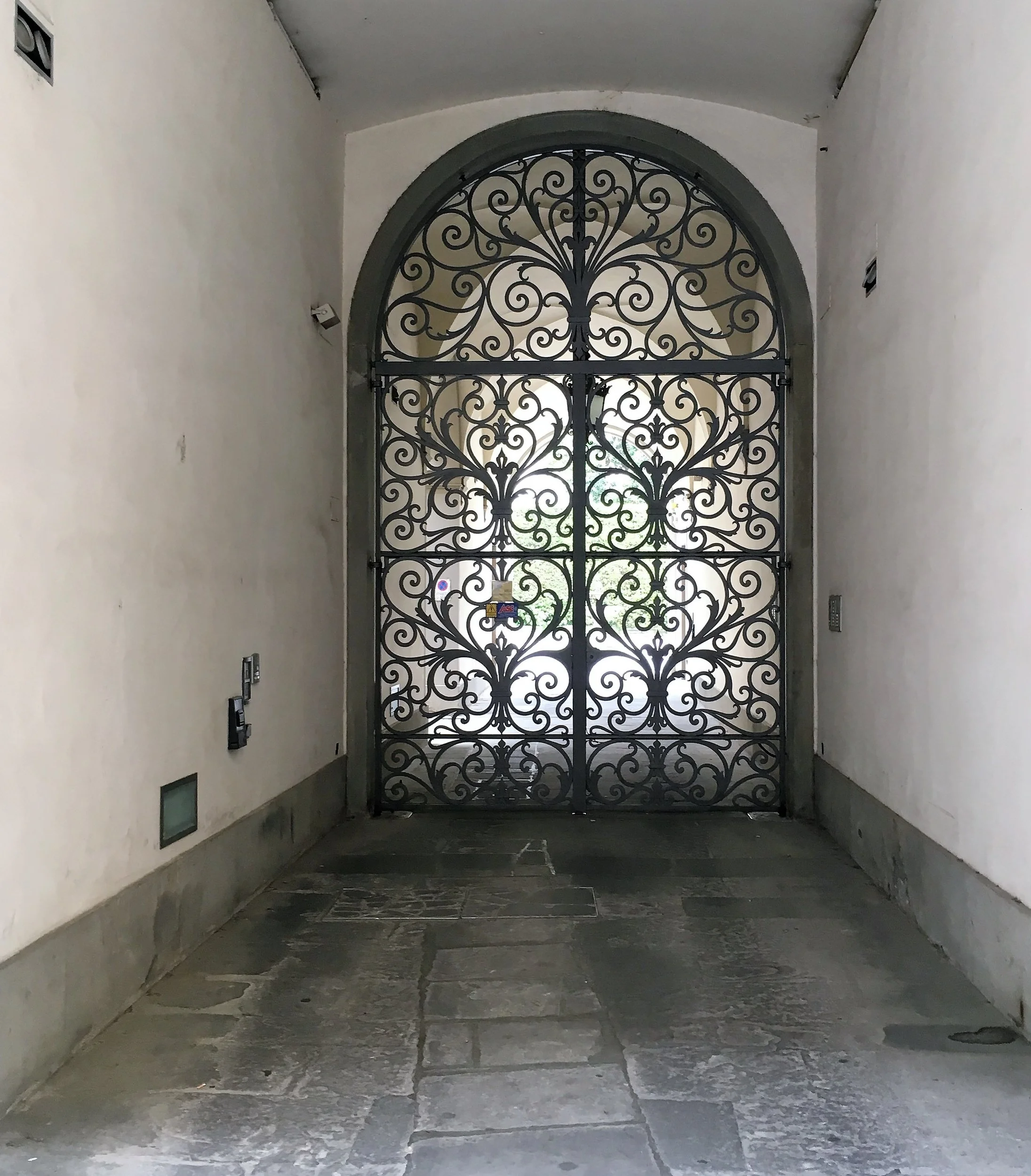A gate at the entrance of a courtyard in Florence, April 2016.