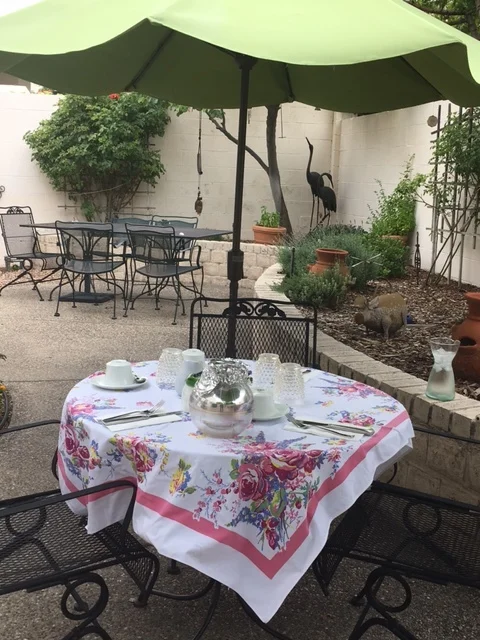 The table is set for brunch on the patio.