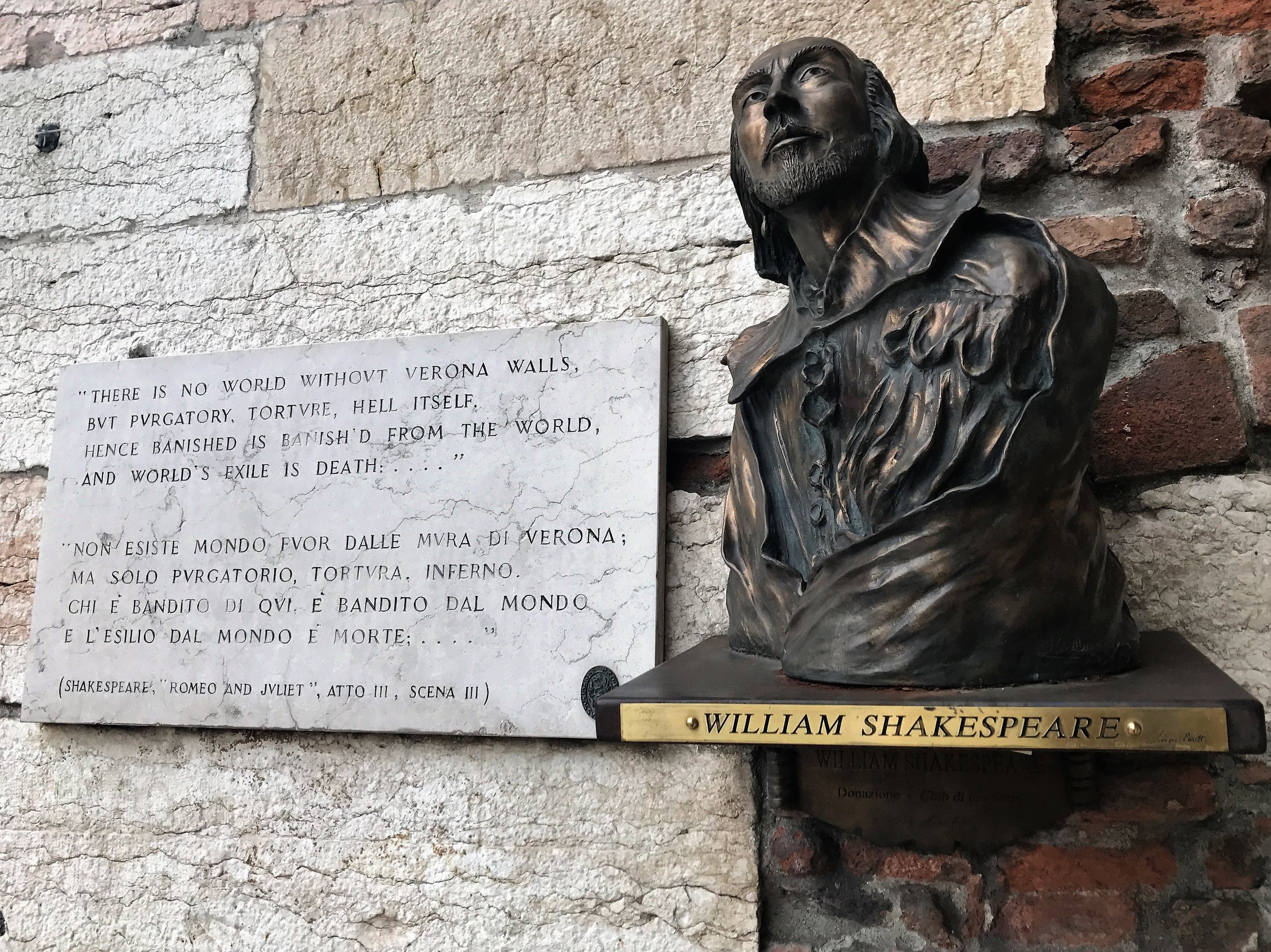 Shakespeare's likeness and words on a wall in Verona