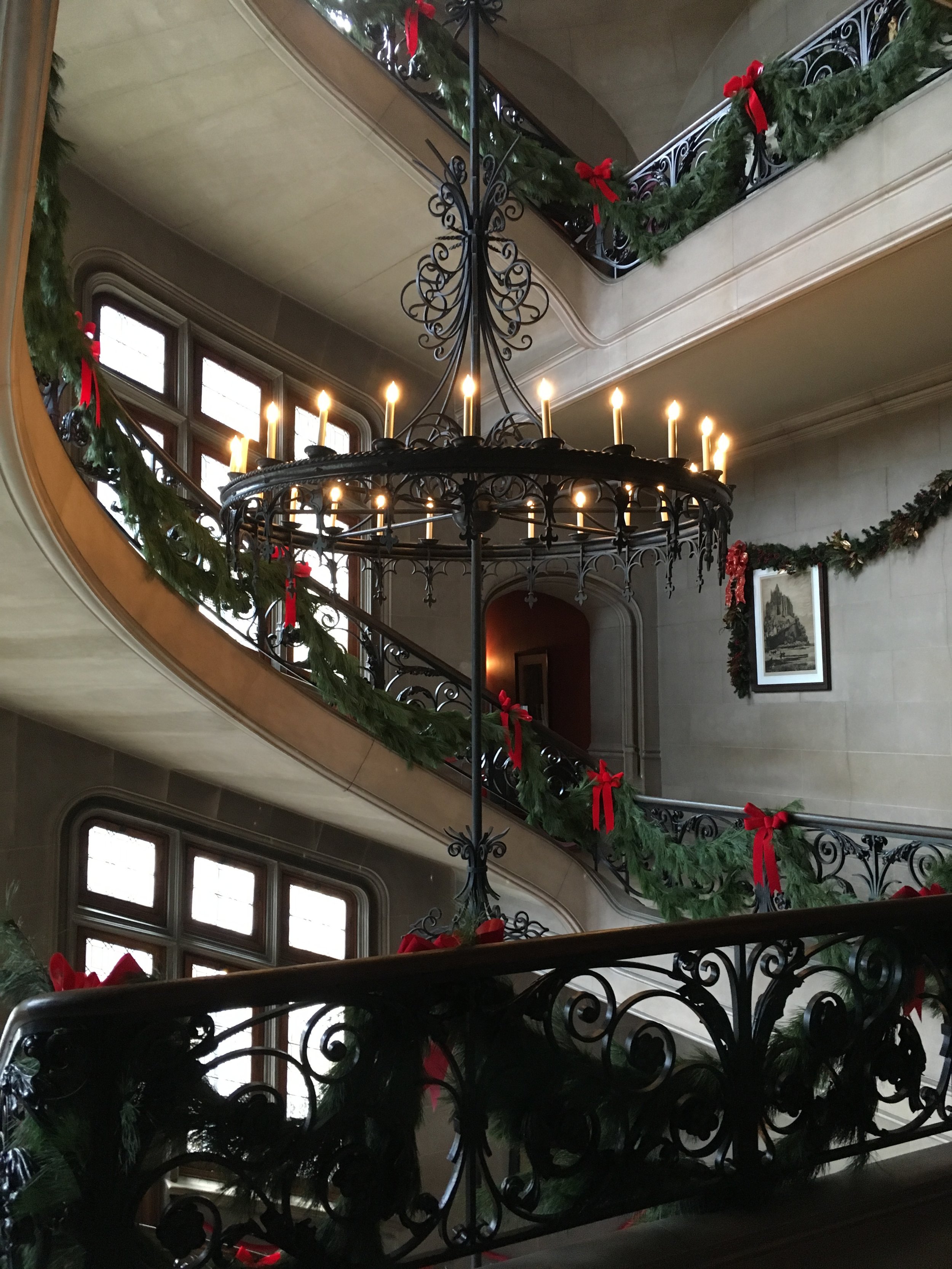 Central staircase wrapped in greenery