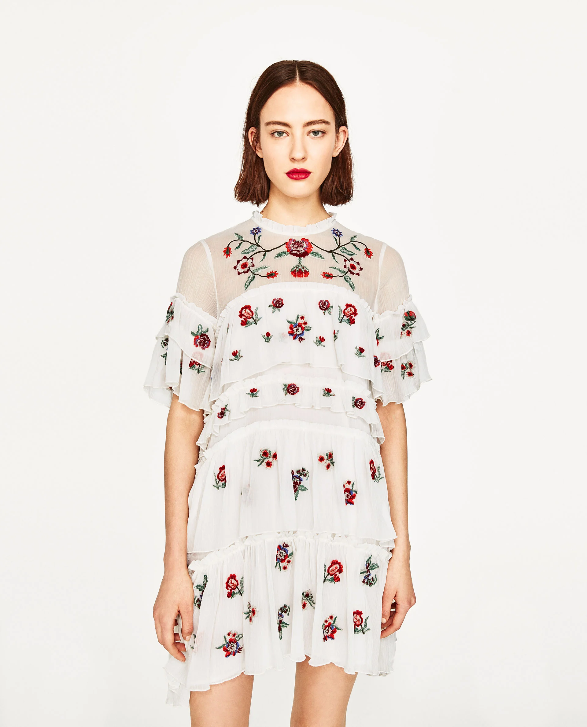 If you're trying to accomplish a killer luxe for less look, pay close attention to fabrics, shapes and little details. The sweet ruffled neckline of this piece and the delicate hanging layers look elegant and slightly antique. The embroidered floral details make this dress extra special and runway ready. 