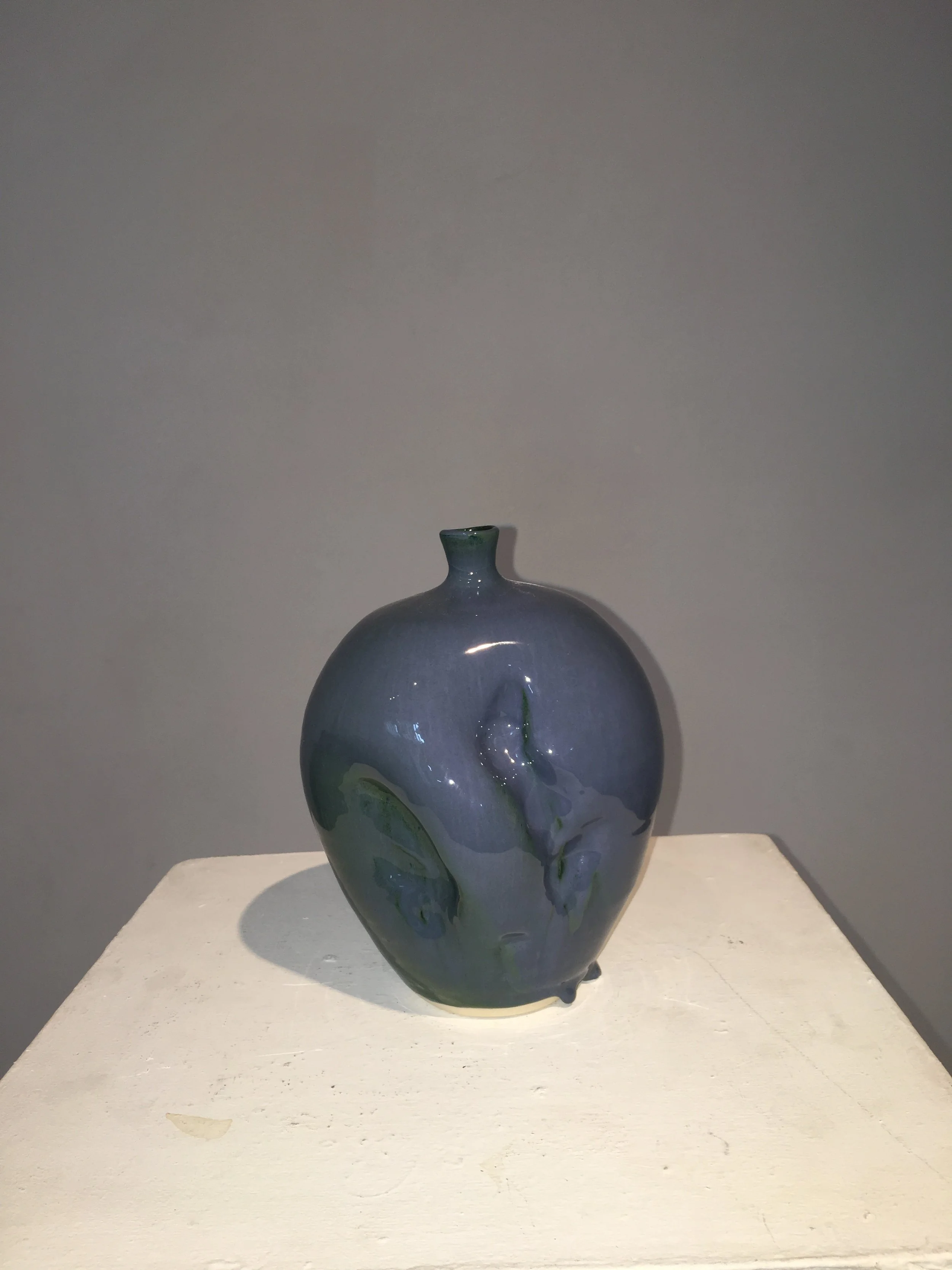 Bright solid glaze with unintentional drippage onto kiln shelf 1