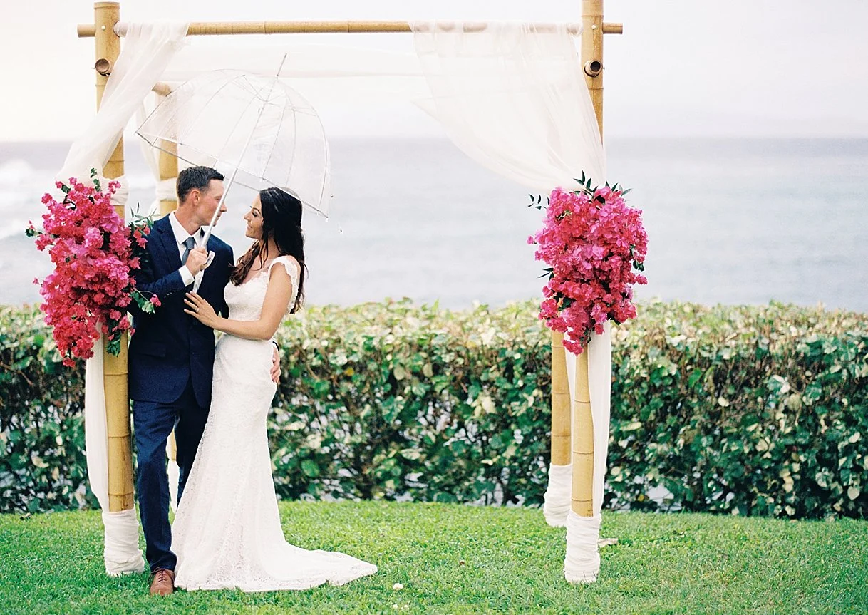bride-groom-bougainvillea-umbrella.jpg