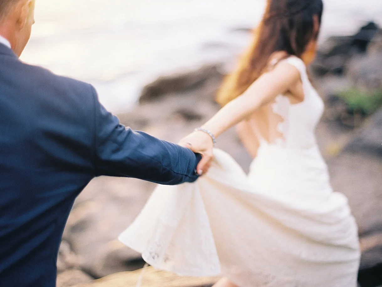 bride-groom-walking-holding-hands.jpg