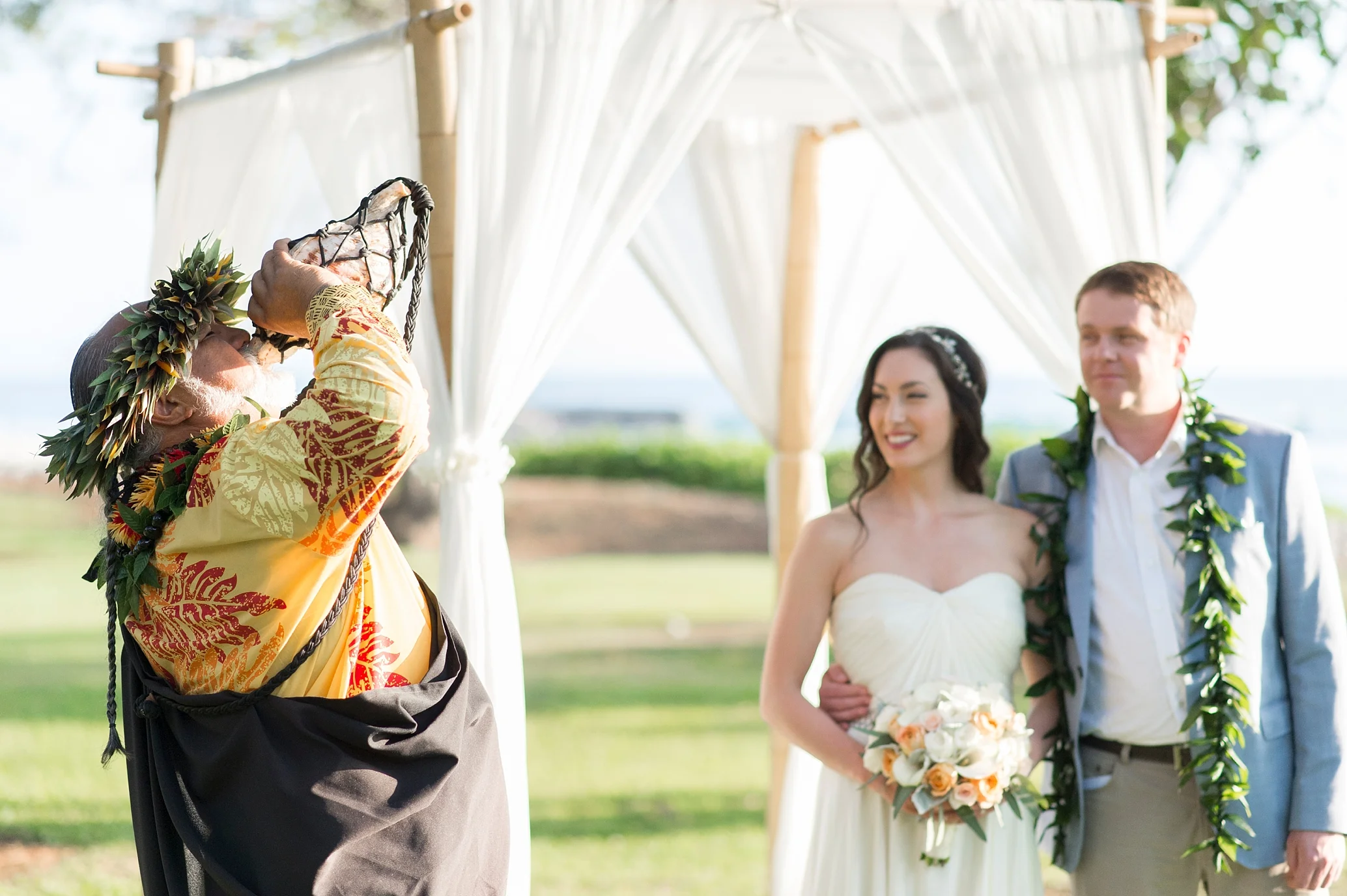 20-hawaiian-officiant-blowing-konch-shell.jpg
