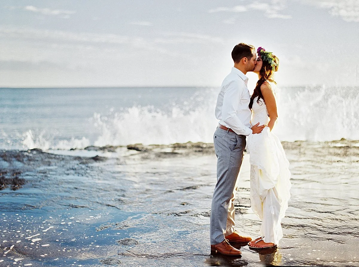 68-bride-groom-ocean-wave-crash-kiss.jpg