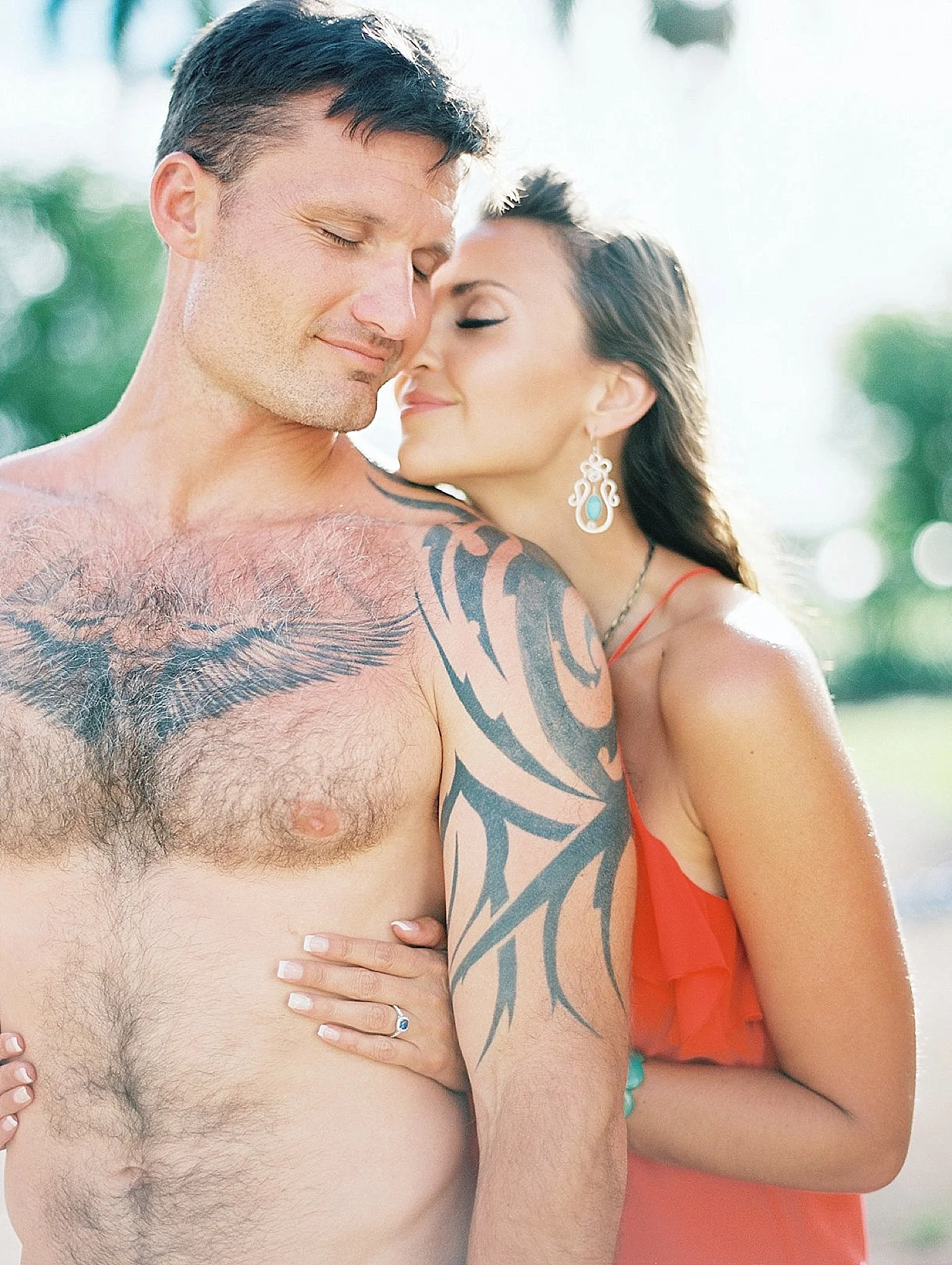 gorgeous-couple-maui-engagement-photos-red-dress-bride-groom-embrace