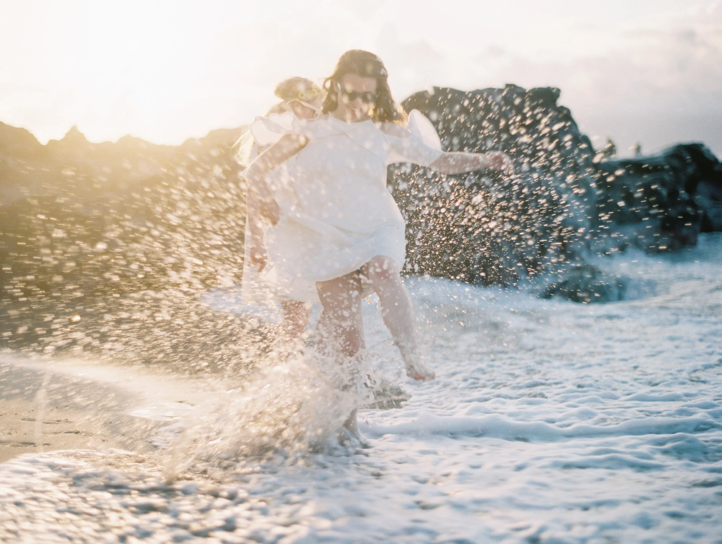 maui-family-beach-portrait-sisters-playing-water-bokeh