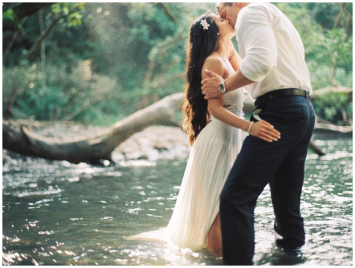 maui-wedding-photographer-bride-groom-water-kiss-romantic-waterfall-wedding