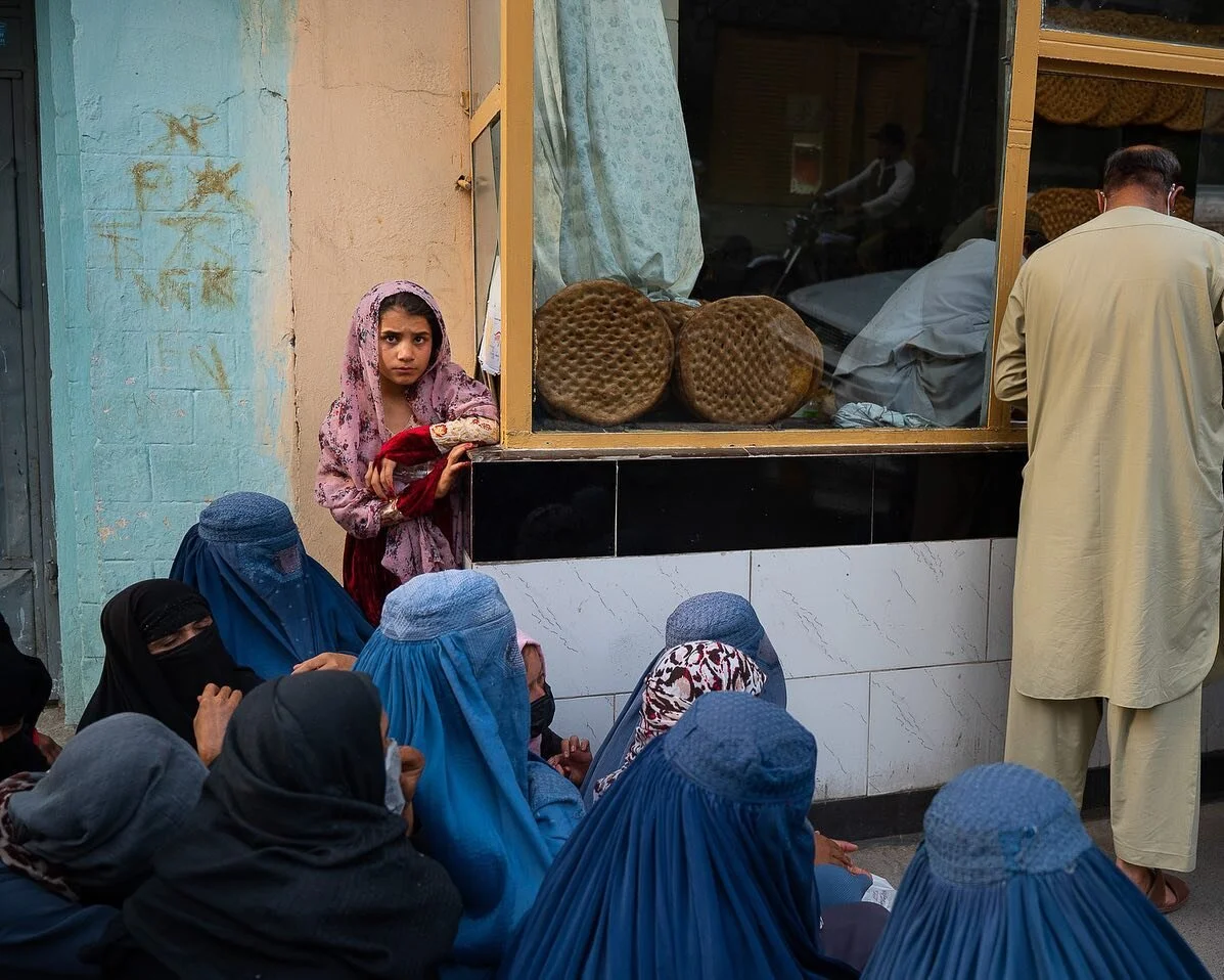 Kabul one year later. Not as clear-cut as it can seem from afar. One thing I do see everyday is more and more scenes betraying growing, devastating poverty like women waiting in front of bakeries, many of them widows or whose husbands have lost their