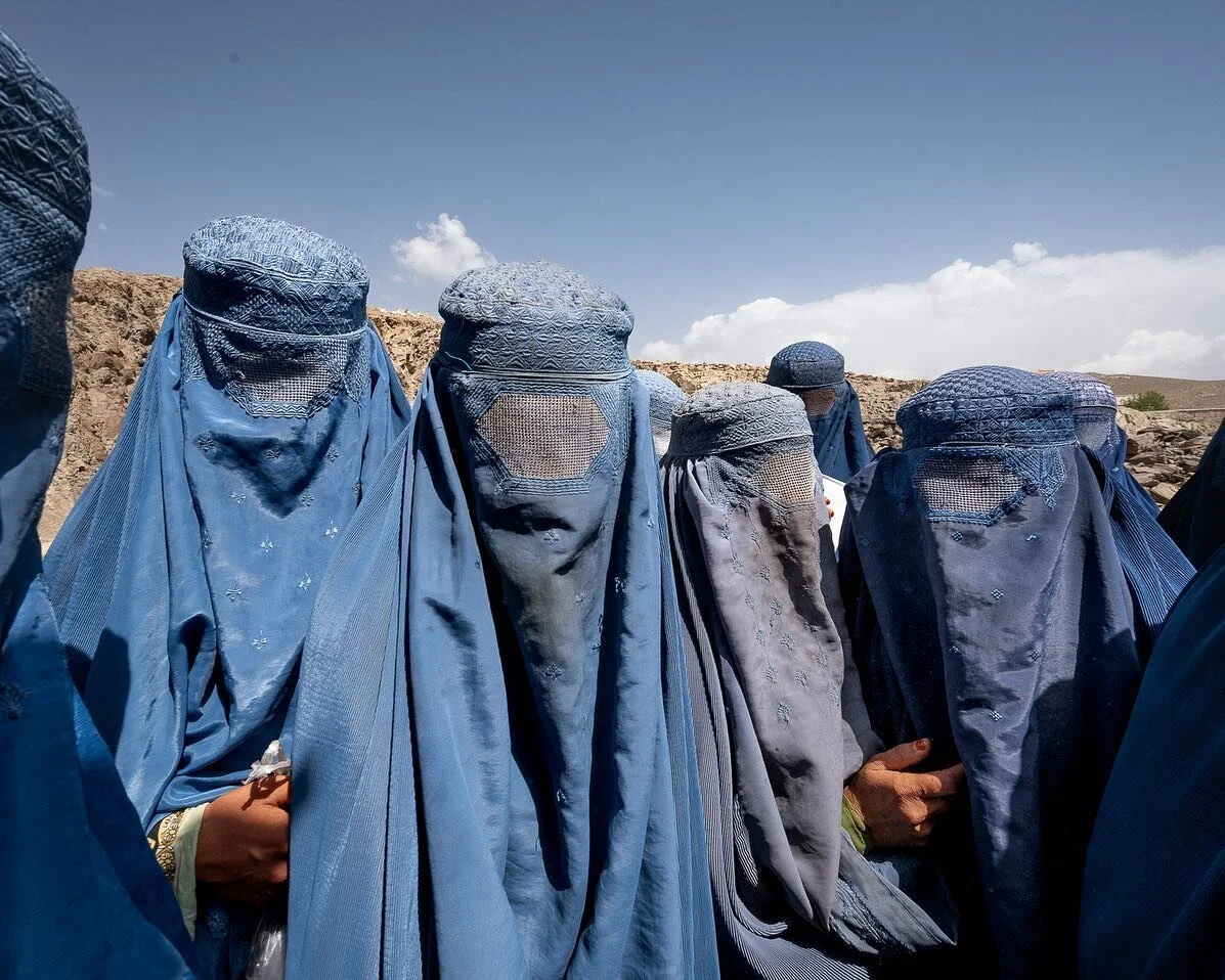 Women wait at a WFP distribution in remote Chak district, hoping to get some of the remaining food as they are not on the list of eligible families. Only those deemed most destitute will receive a package, which means 3200 out of 25,000 people. In a 