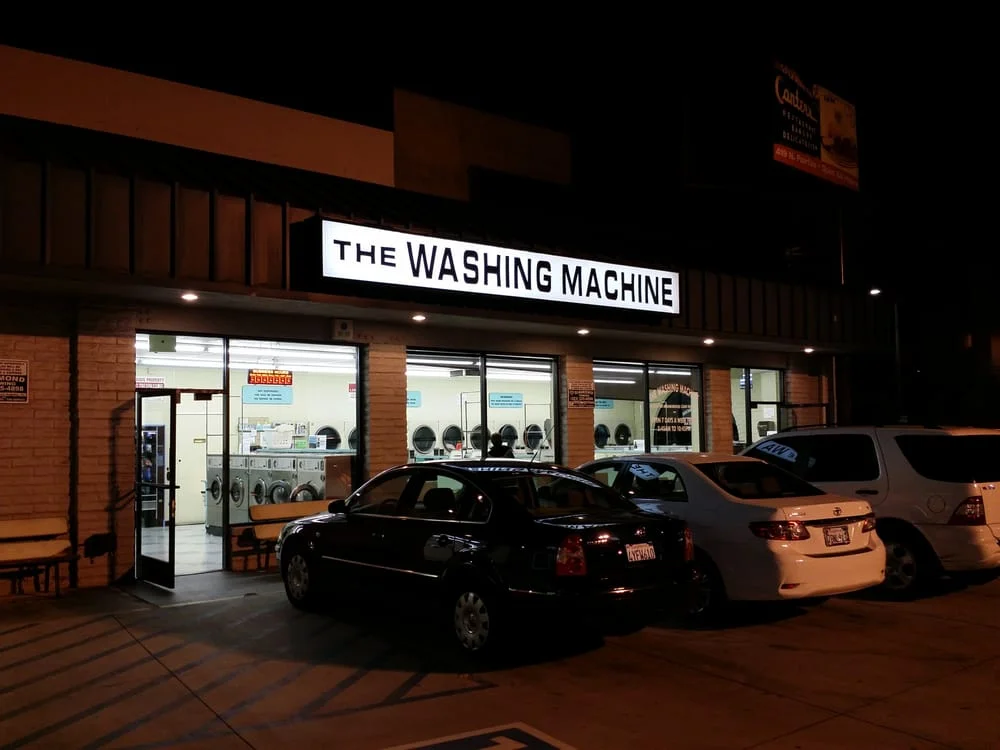 Another exterior shot of the laundromat at night