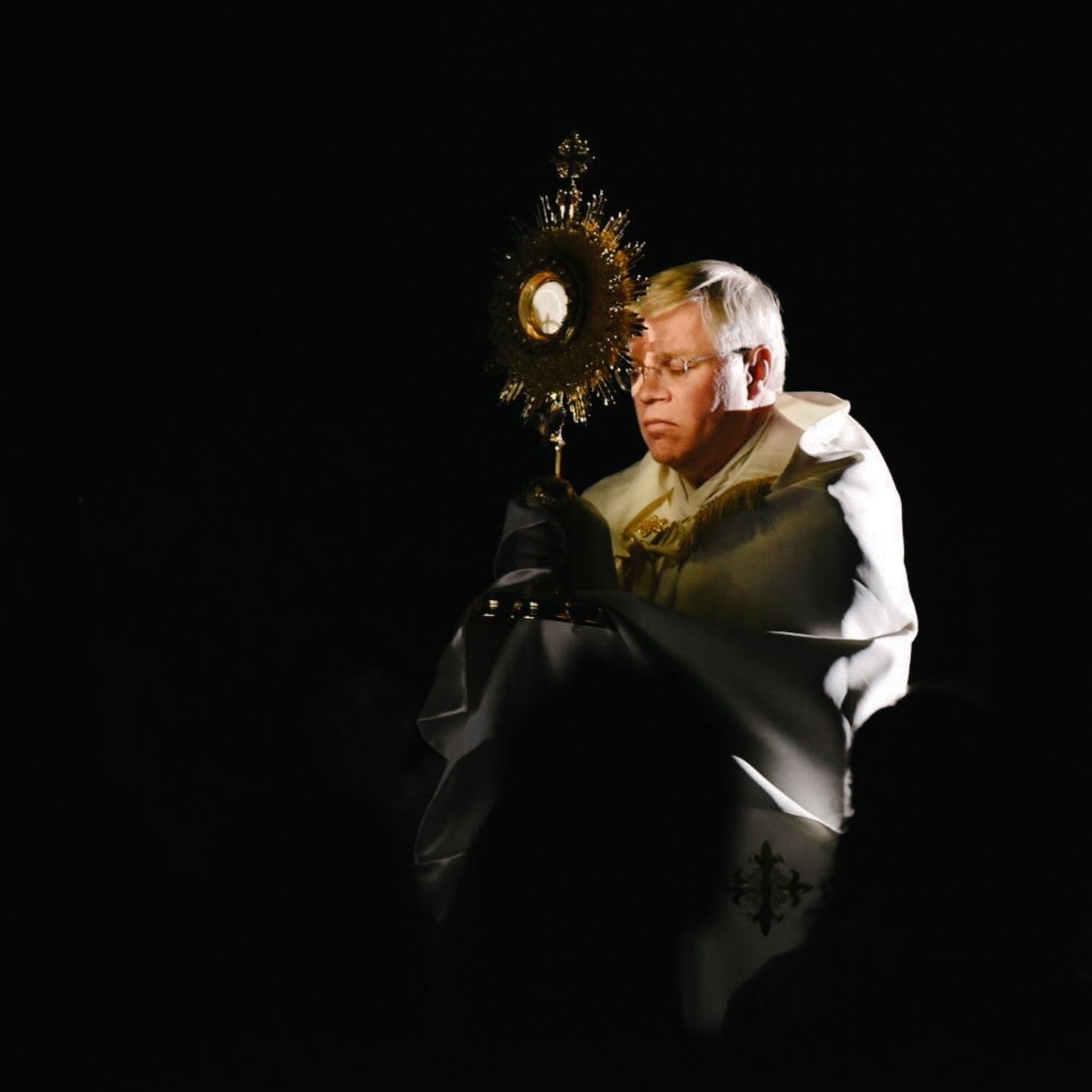 Priest carrying Monstrance
