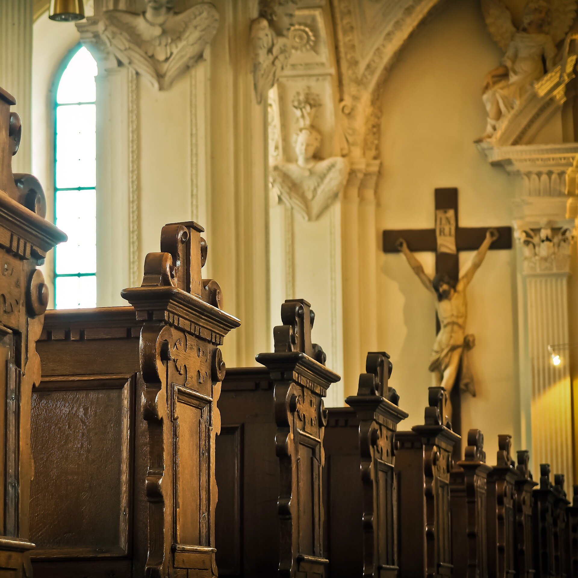 Crucifix and Pews in Catholic Church