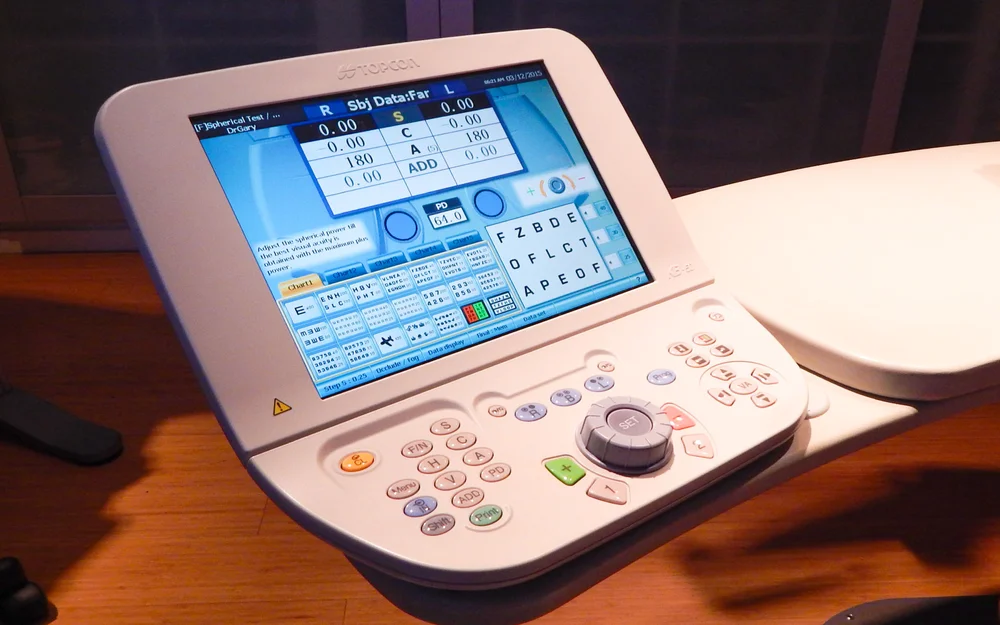 Digital phoropter control panel used during comprehensive eye exams at iCare Family Vision