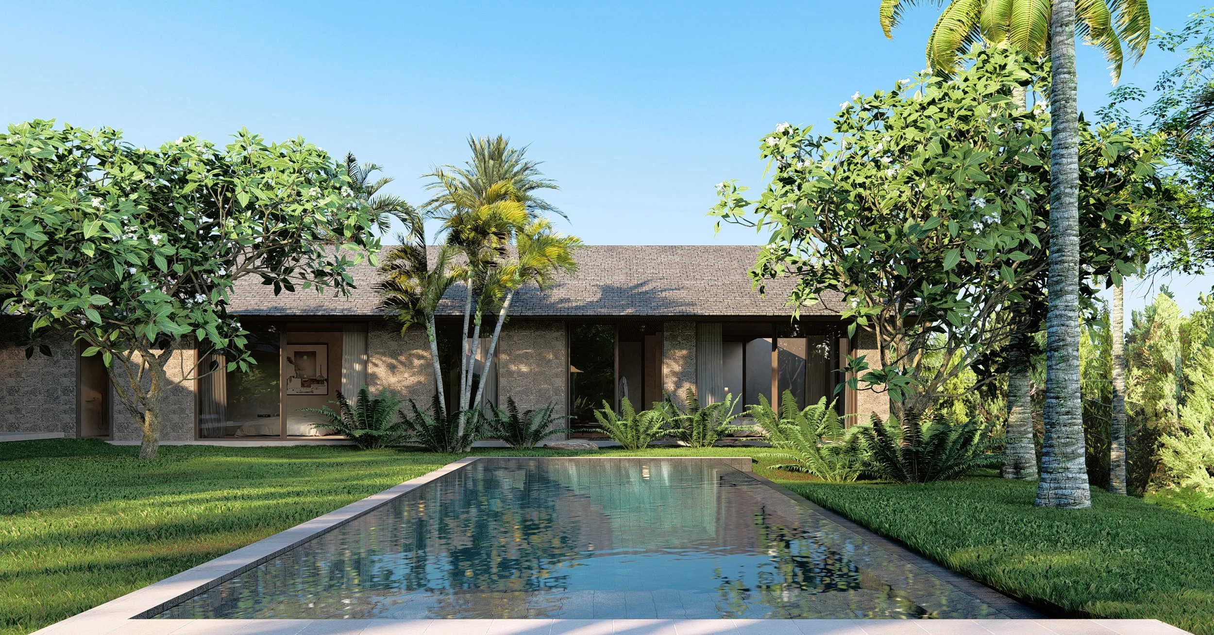 Private pool courtyard at Kelusa house showcasing sustainable tropical villa architecture in Bali with stone textures and tropical vegetation.