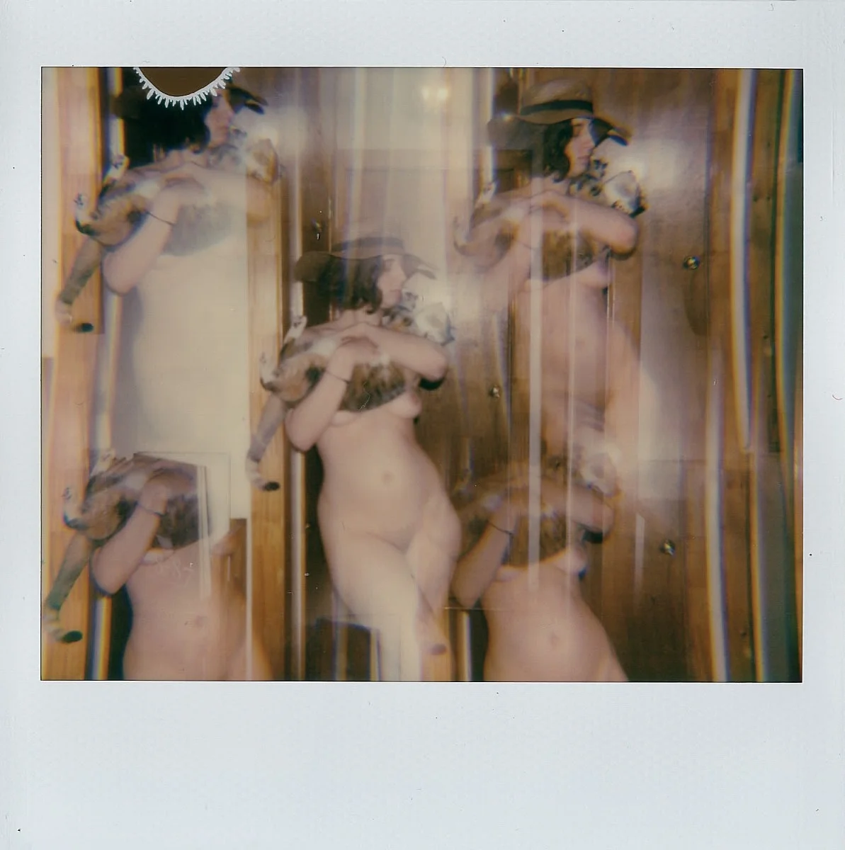 My sister and our kitty Lolita in Brooklyn, NY -- Polaroid Spectra -- February 2017