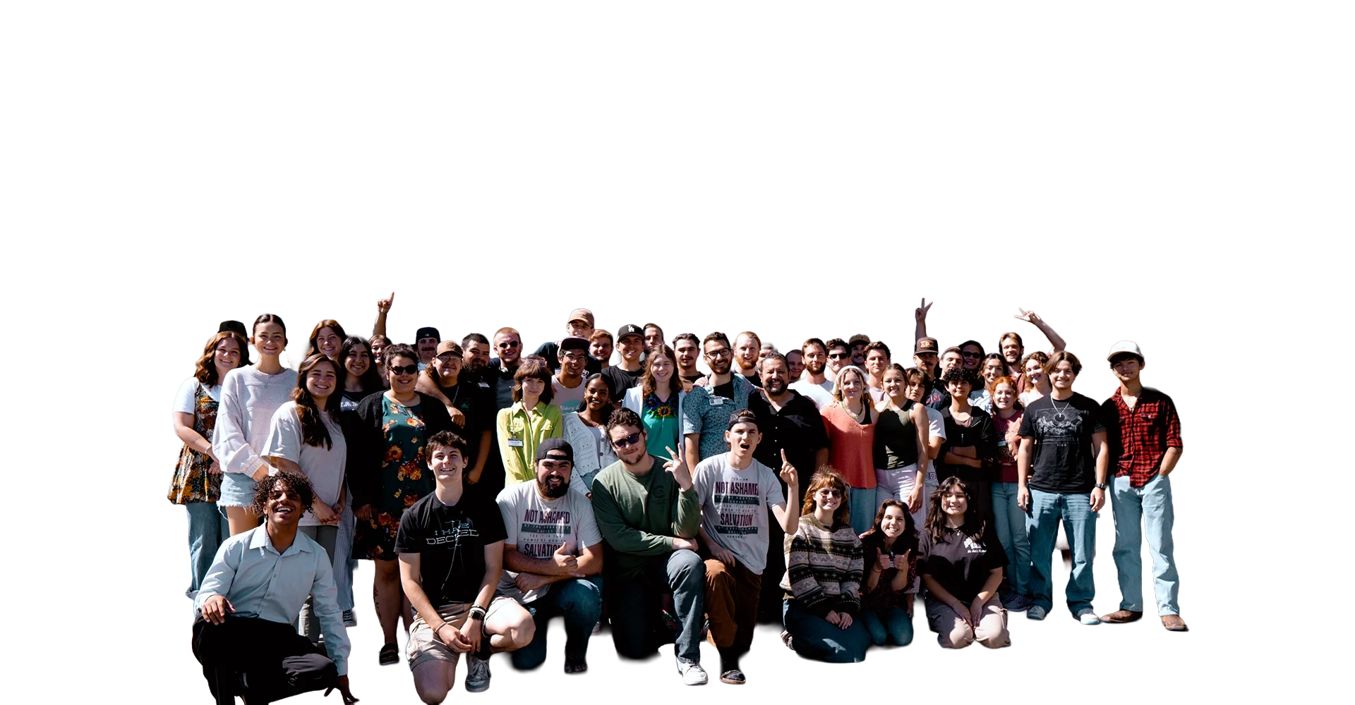 A large group of diverse young people posing for a photo outdoors on a sunny day.