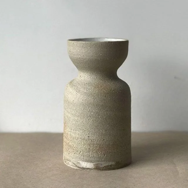Black and porcelain mixed clay, strange 'lil swirl of it at the base. 👀
.
.
#ceramics #vase #handmade #wheelthrown #clay #bikisceramics #keramik #pottery #mix #stoneware #porcelain