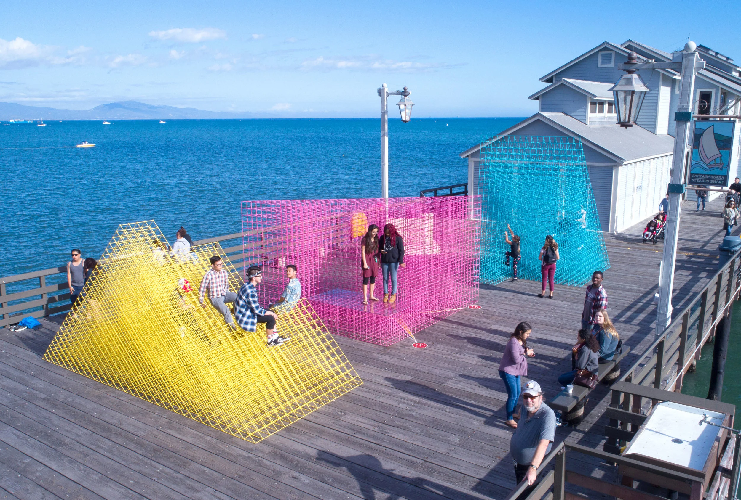 Pier visitors sit, stand, and climb on Runaway at Stearns Wharf. Photograph from Elliot Lowndes.
