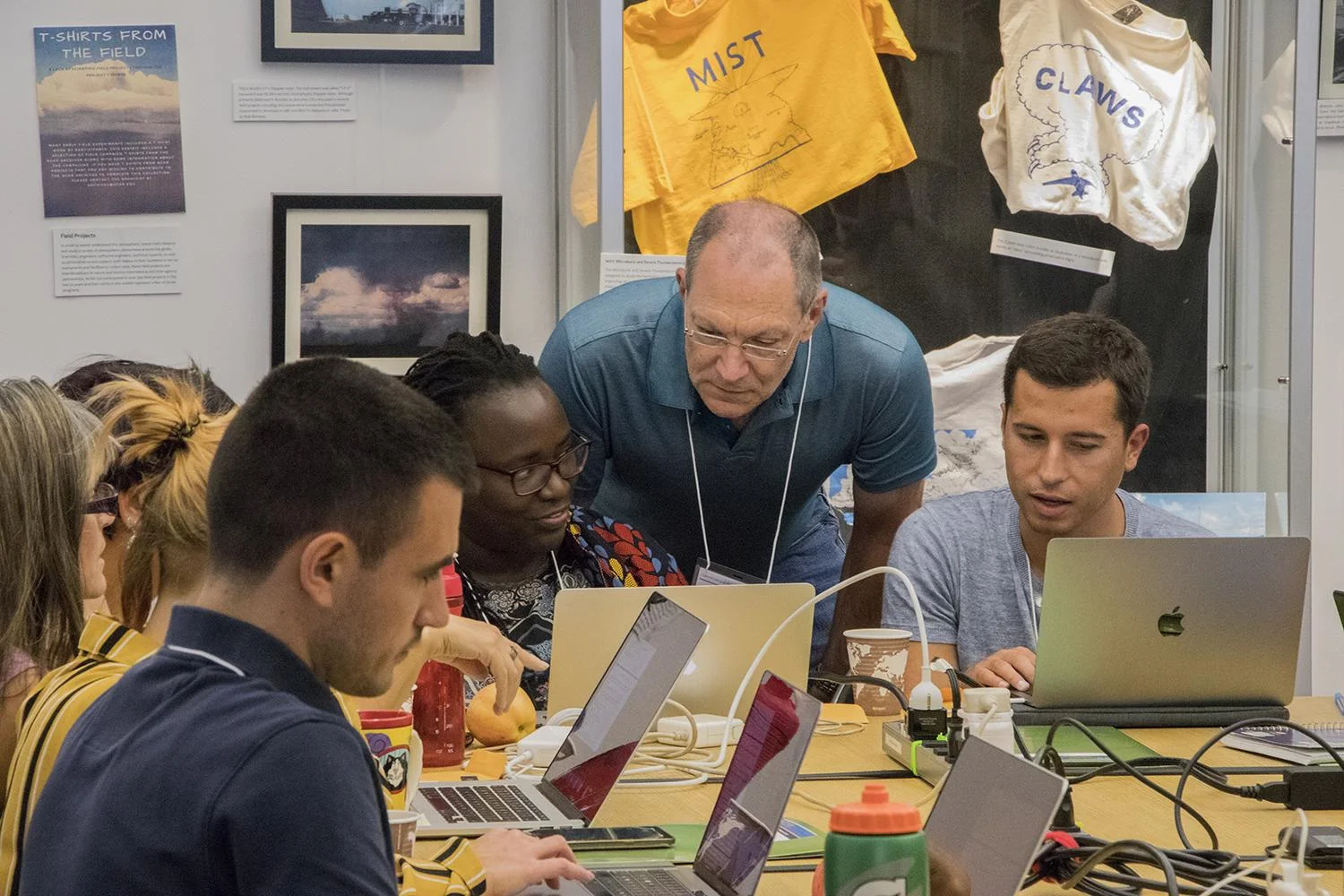 Keith Oleson helps tutorial students run CESM. Photo: @NCAR_CGD