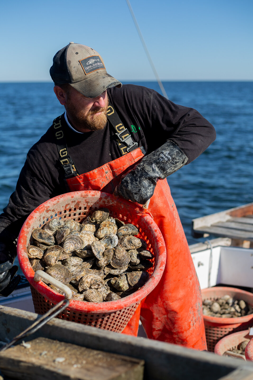  Captain Dale "Simon" Dean of Patuxent River Seafood moving a catch of oysters around his boat during a day of oystering, Wednesday, Nov. 7, 2018 in Solomon Island, MD. As a part of the Dock to Dish nonprofit program, this local waterman supplies oys
