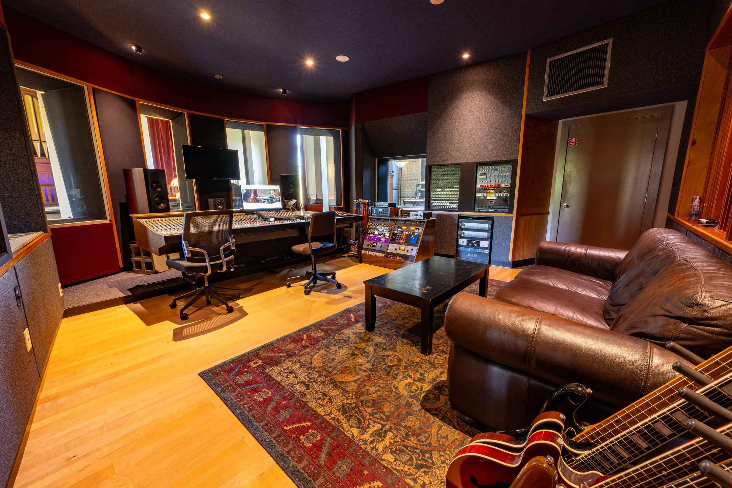 GHR’s spacious and professionally designed control room. Featuring our modded DDA AMR24 analog console, ATC SCM50 monitors, and tons of outboard gear.