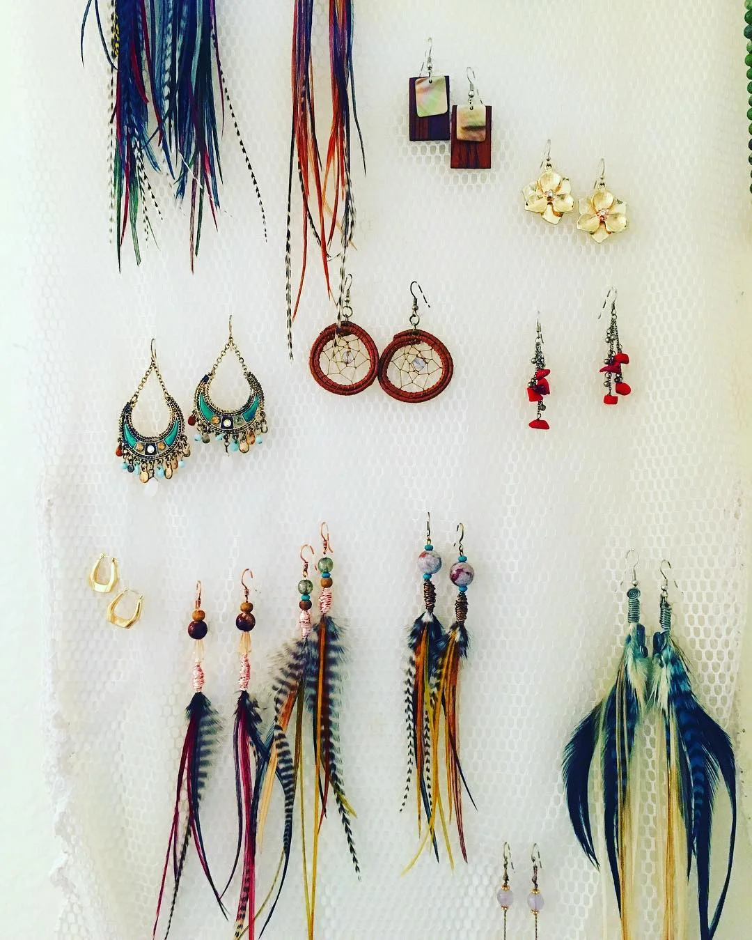 A lot of the time, hosts wonder if they should put away their personal belongings if they host where they live. The Abundant Host says: As long as it's not cluttered, don't! Displaying things in a way that's unique to you—like these earrings showcased on a simple cloth (actually a repurposed laundry bag!) can be inexpensive and beautiful