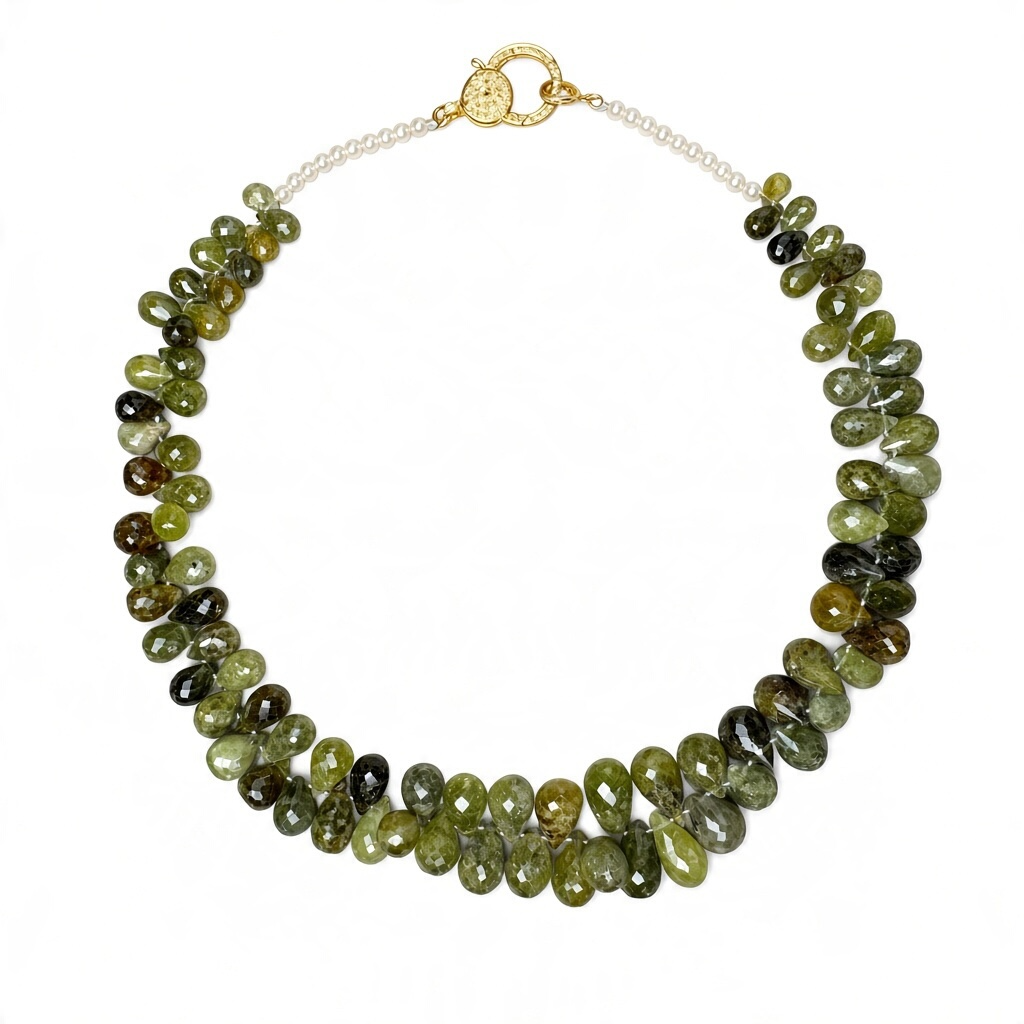 Green grossular garnetnecklace with faceted teardrop beads, white freshwater pearls, and a gold-plated clasp.