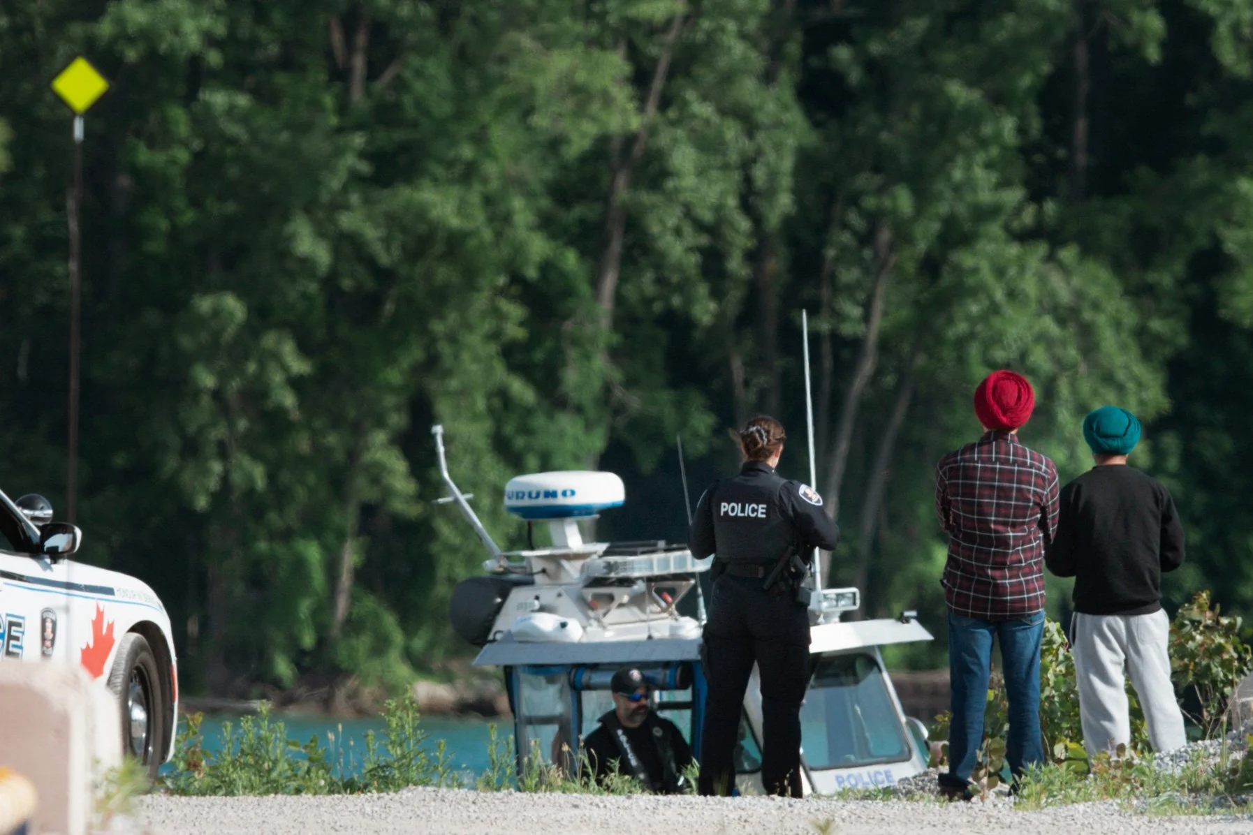  Two males in their twenties from Southeast Asia drown in the Detroit River, west of Sandpoint Beach.  Photos for the Canadian Press. 